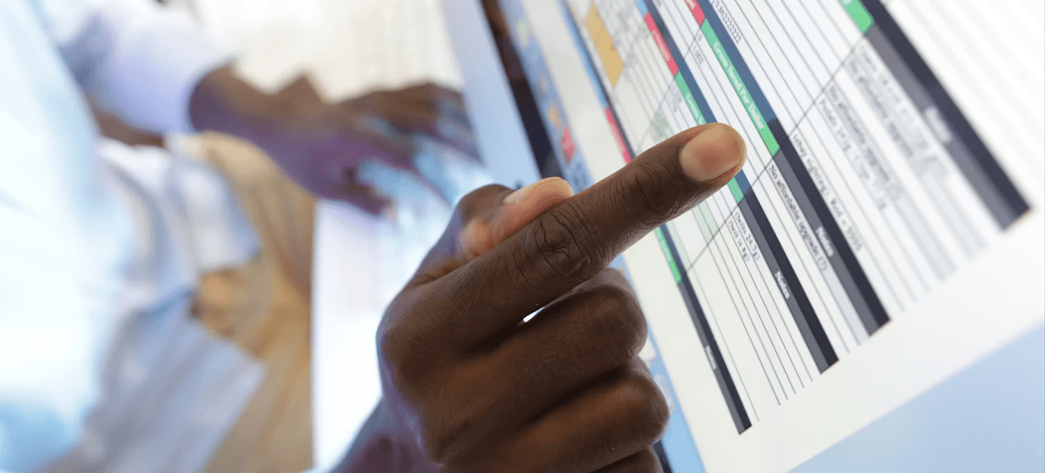  Hands typing data into digital spreadsheet - How to Split Text Into Two Columns in Excel