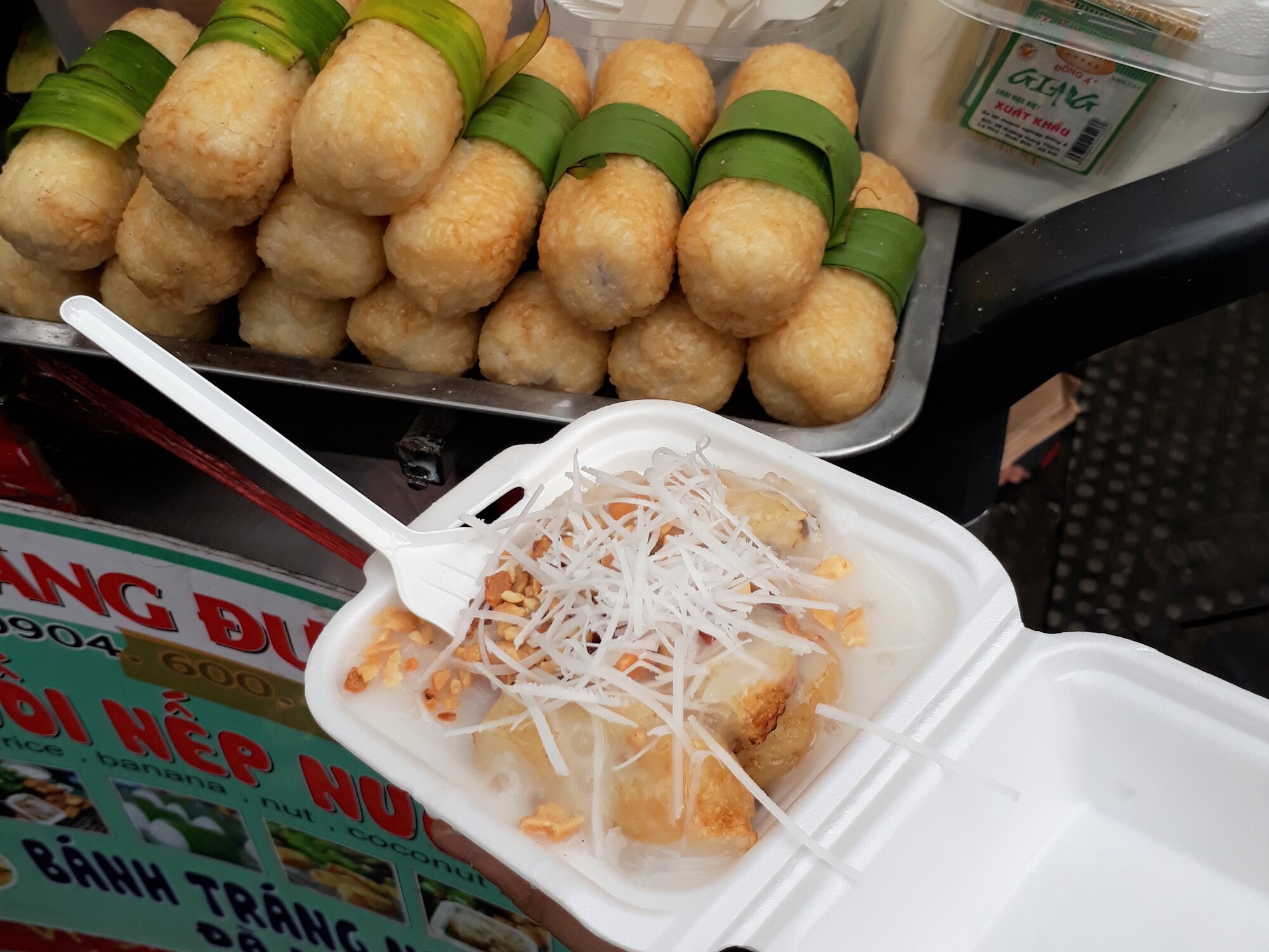 a person is holding a bowl of ice cream