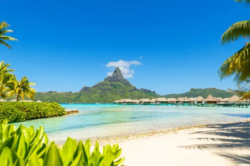 Overwater bungalows on a turquoise lagoon in Bora Bora