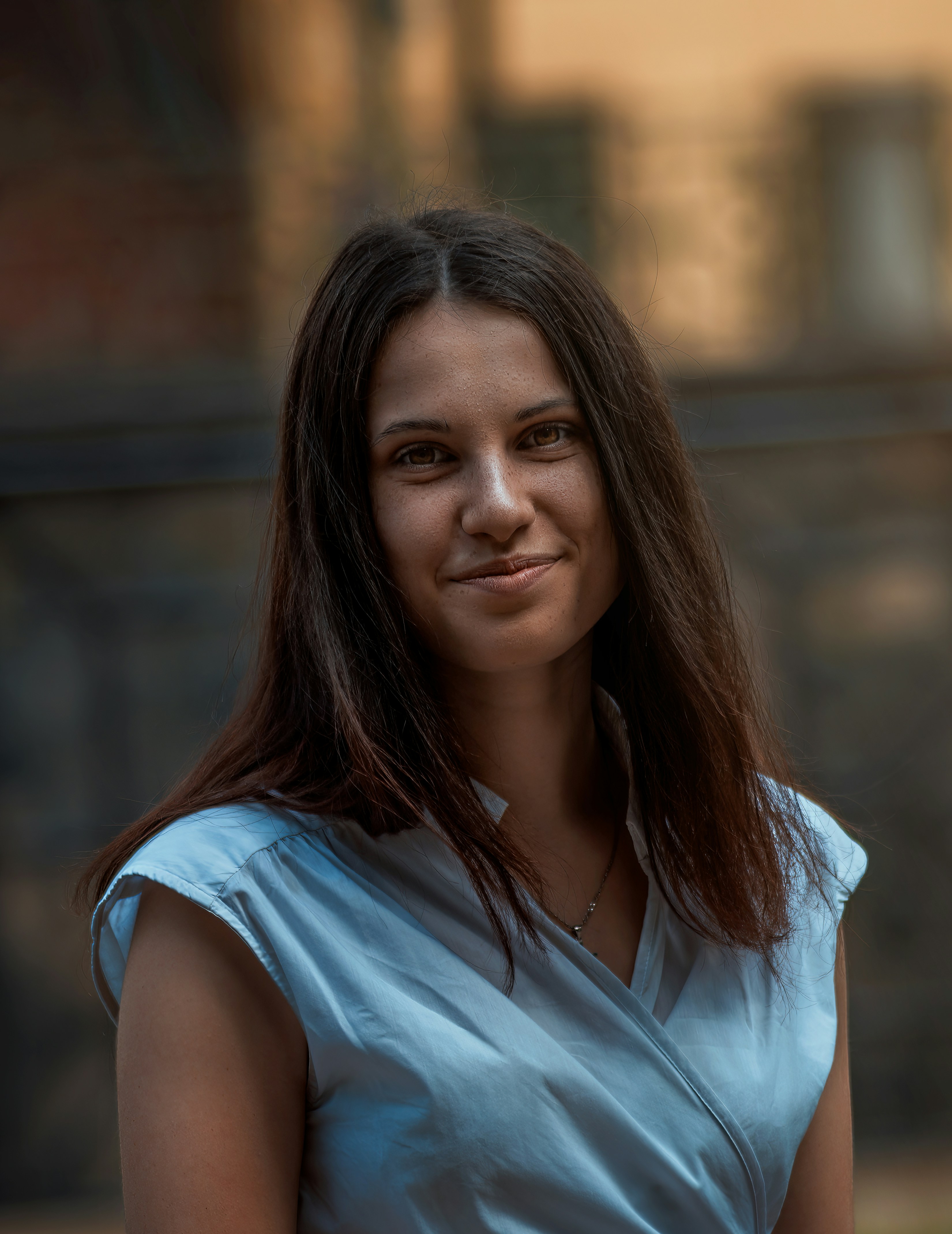 a woman in a blue dress posing for a picture