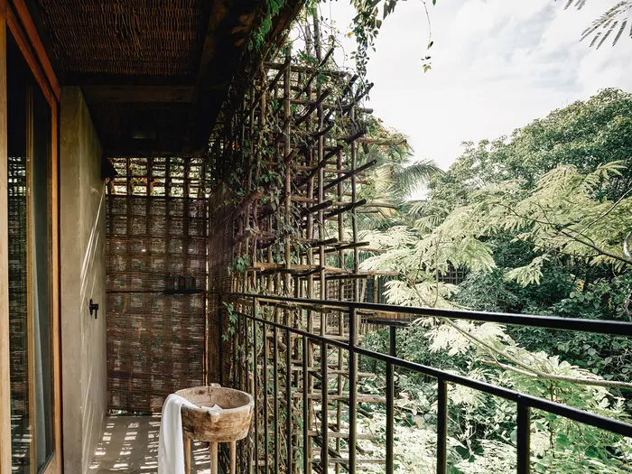 Treehouses at Nômade Tulum featuring amazing jungle view from high up, unique shower and sink with rustic style.
