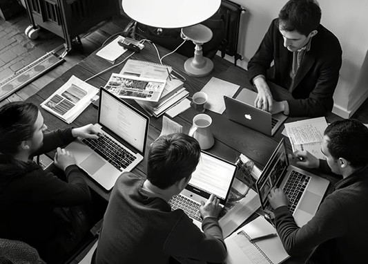 Team siting at the table