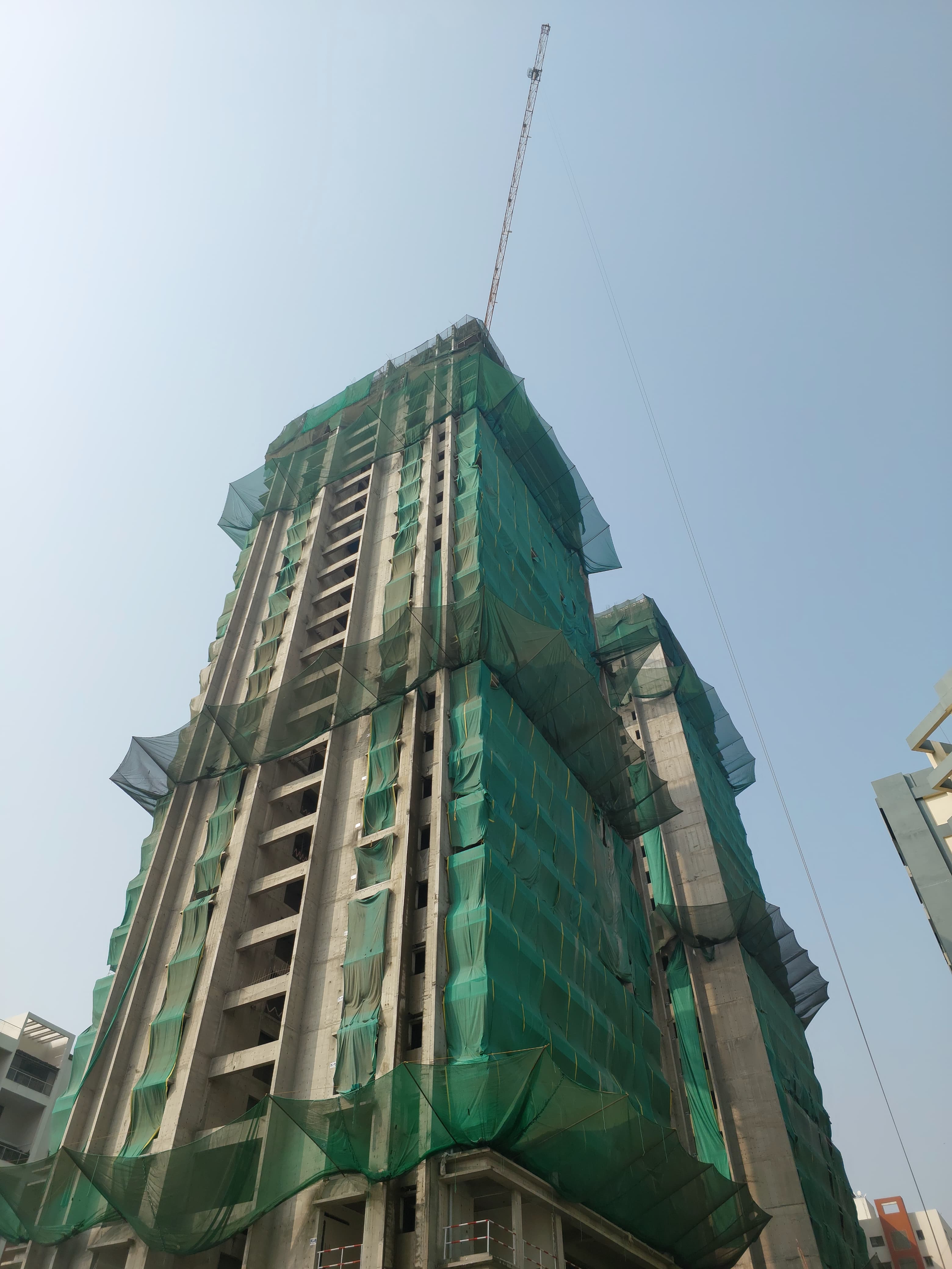 Safety net installation at high-rise construction site in Pune amanora
