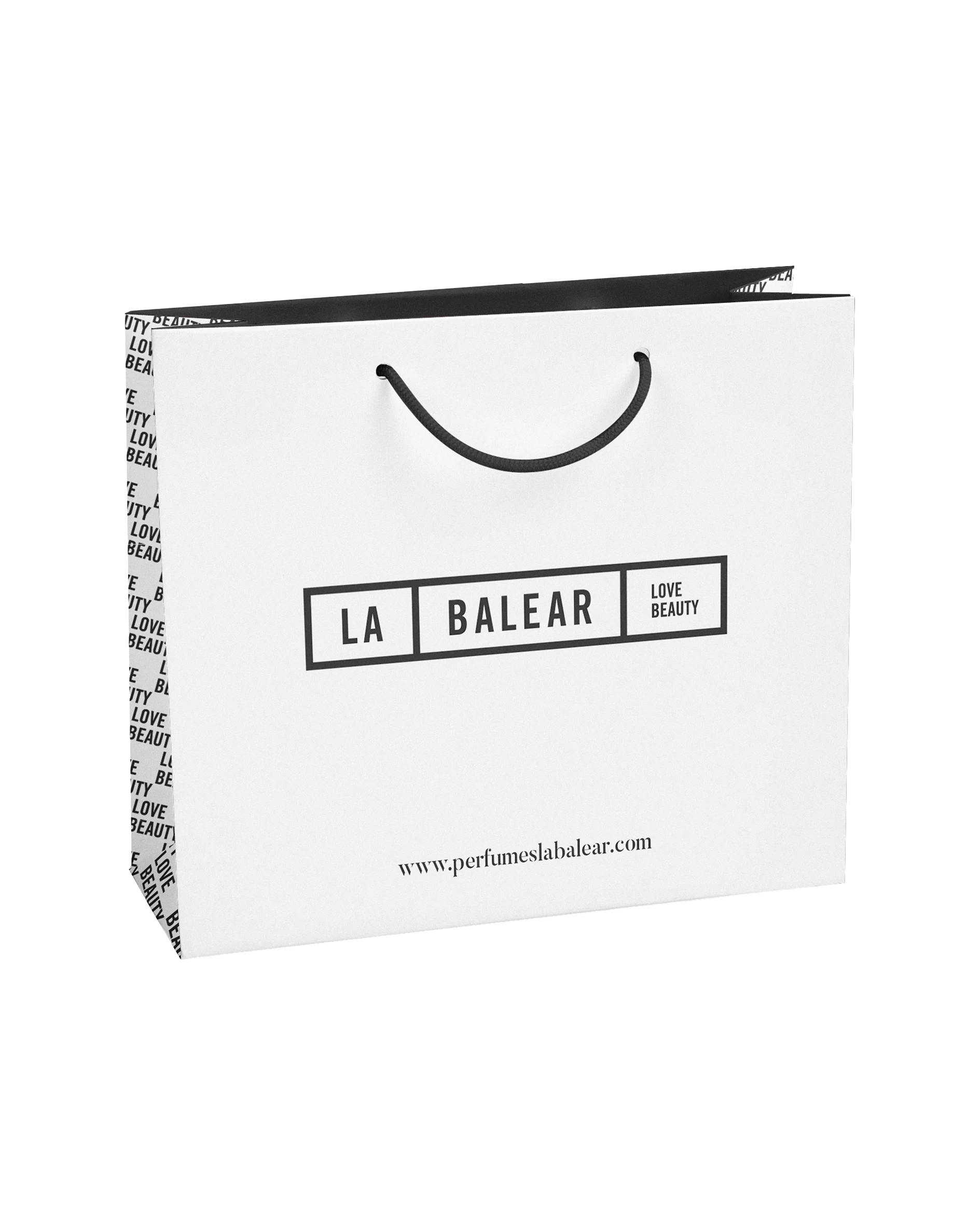 White La Balear shopping bag with a black handle, brand identity design by Sebastian Saavedra