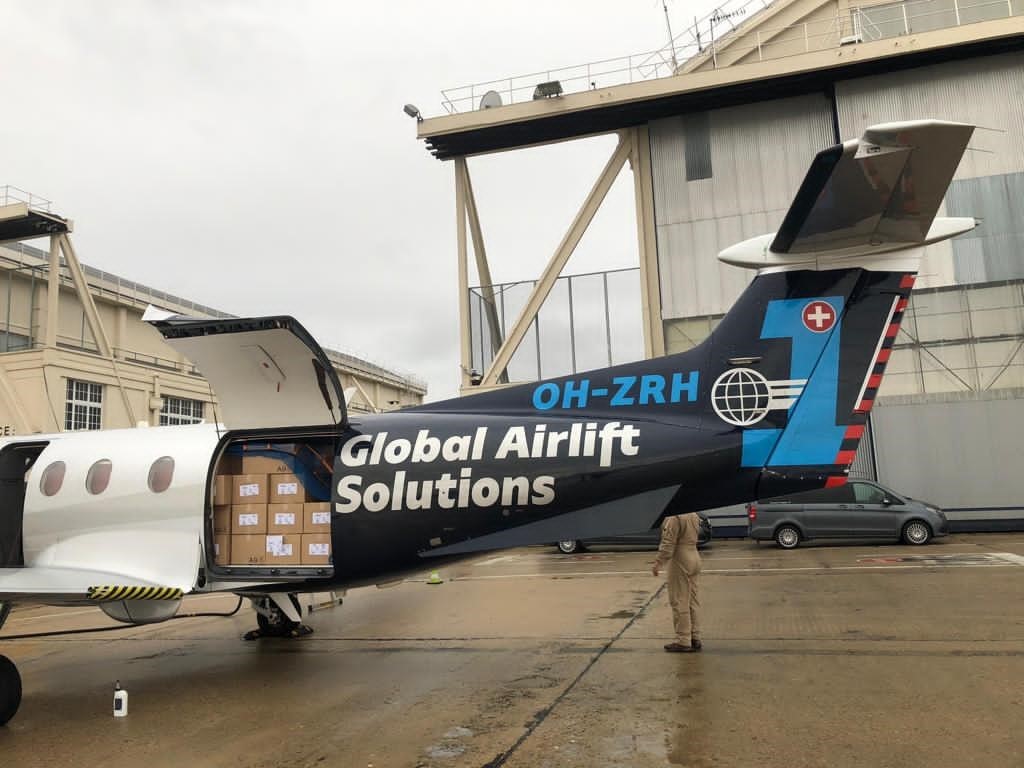 Pilatus PC-12 cargo door open with cargo items