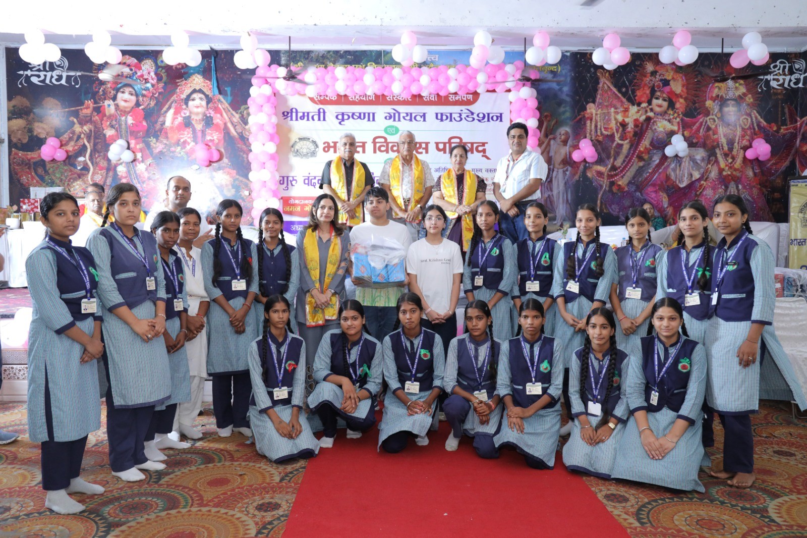 person sitting on grass and using phone