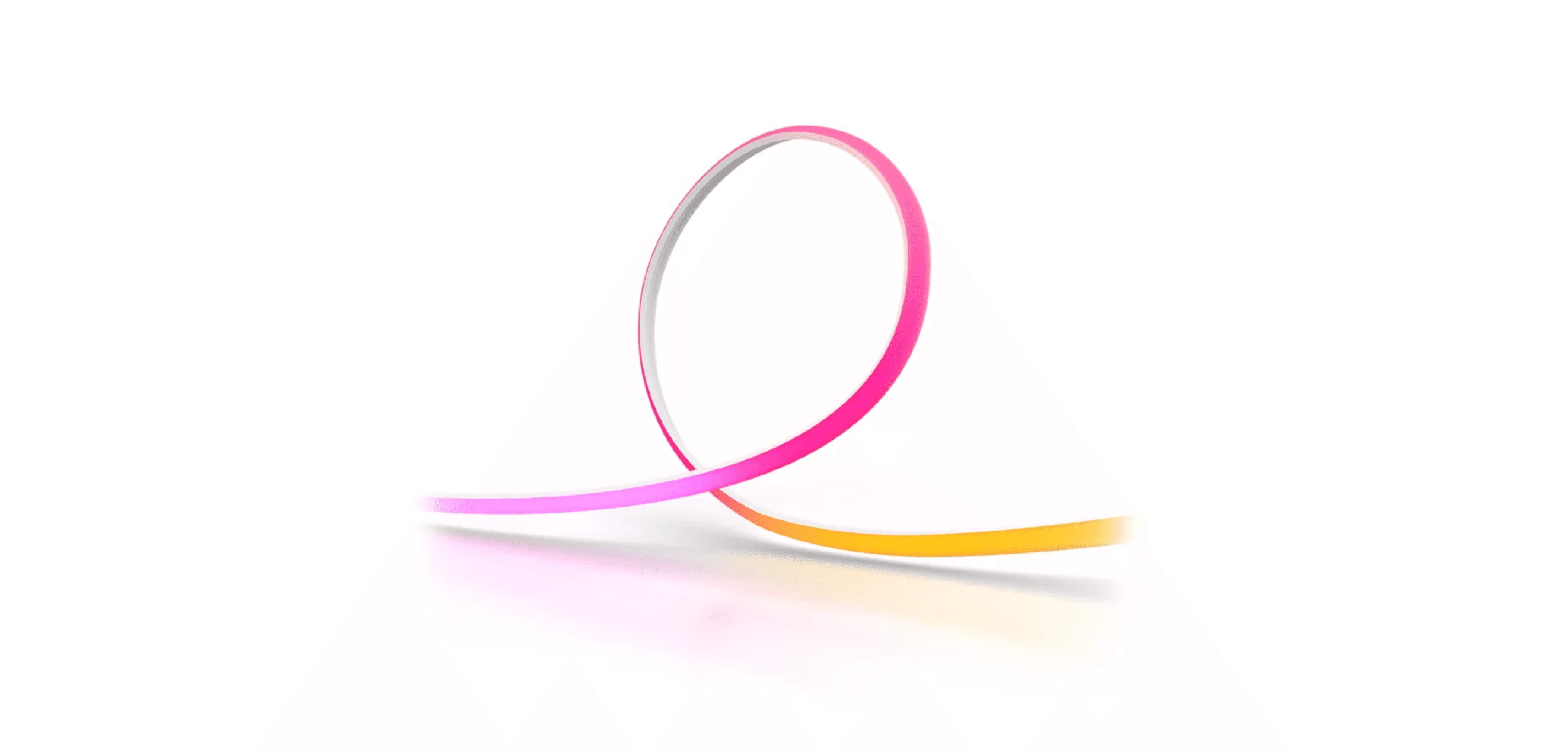 Flexible LED light strip glowing in gradient hues of pink, purple, and orange on a white background.