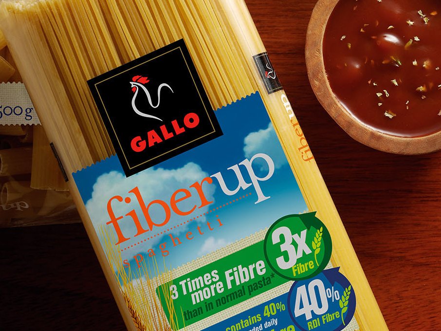 Rooftops of a coastal town with the sea in background