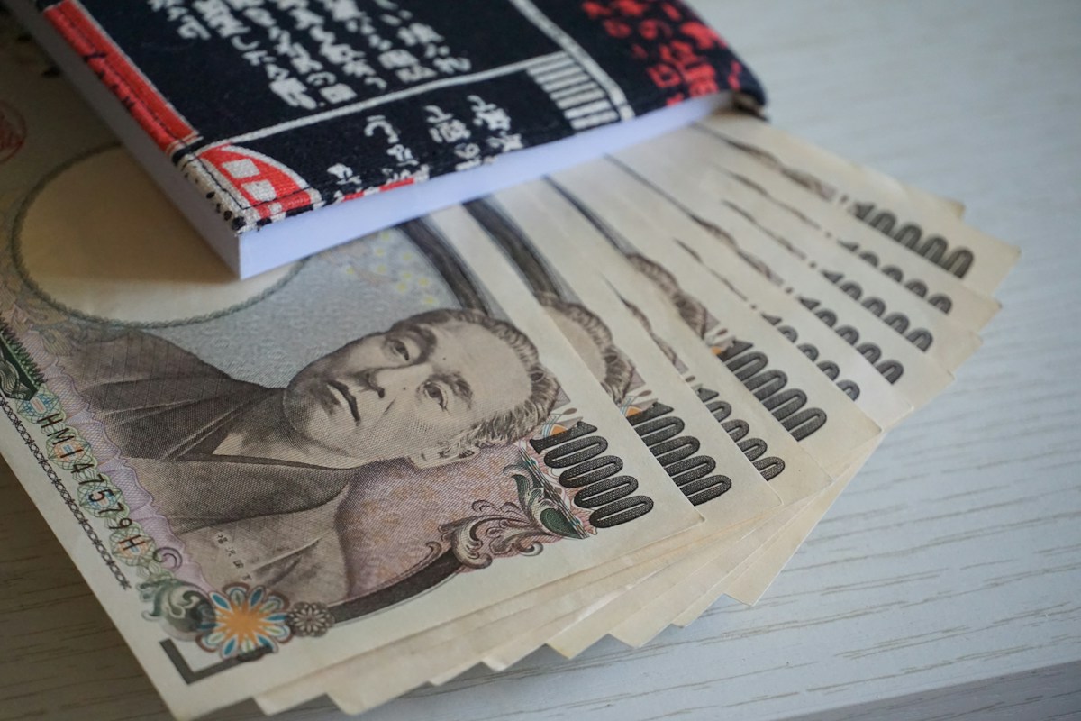 Japanese yen banknotes fanned out on a table