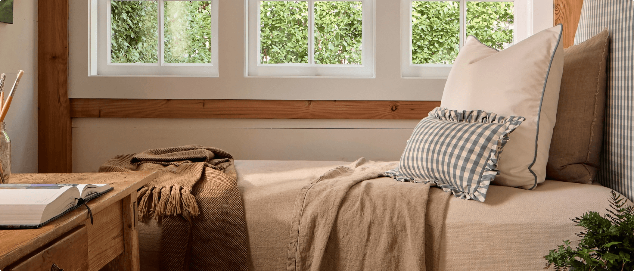 Shopify hero image for Pepper Home featuring styled bedroom with custom home décor