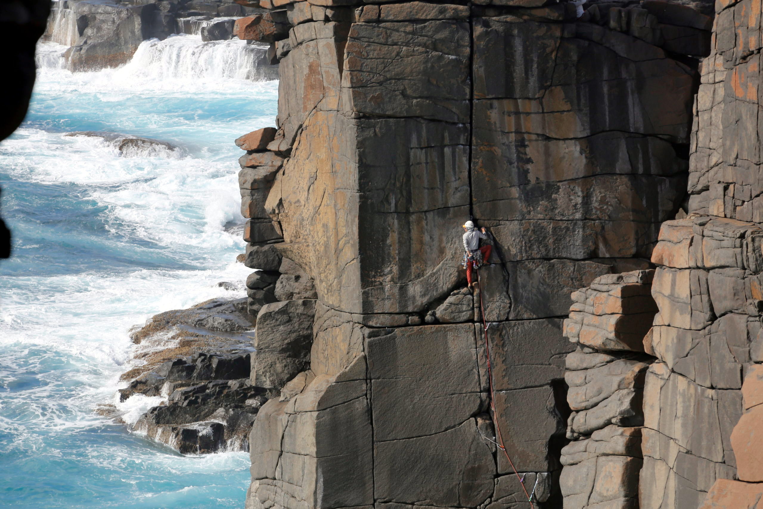 Instructor supervising a climber on a sport route