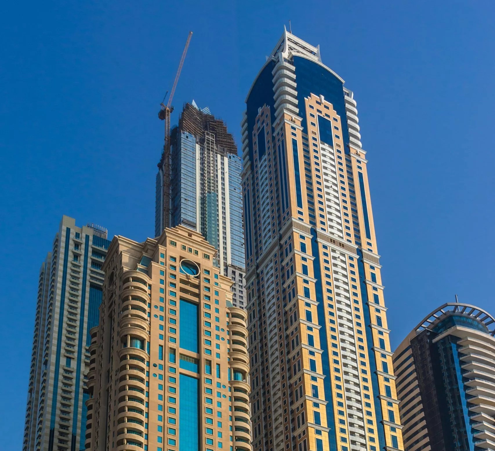Skyline view featuring Marina Crown. Real estate agent services for luxury apartments in the heart of Dubai Marina.
