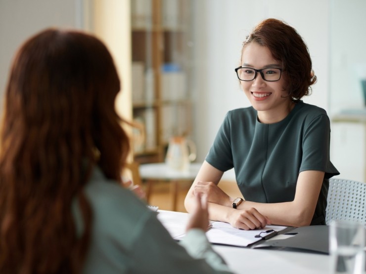 HR professionals discussing employee retention strategies in a modern UK workplace
