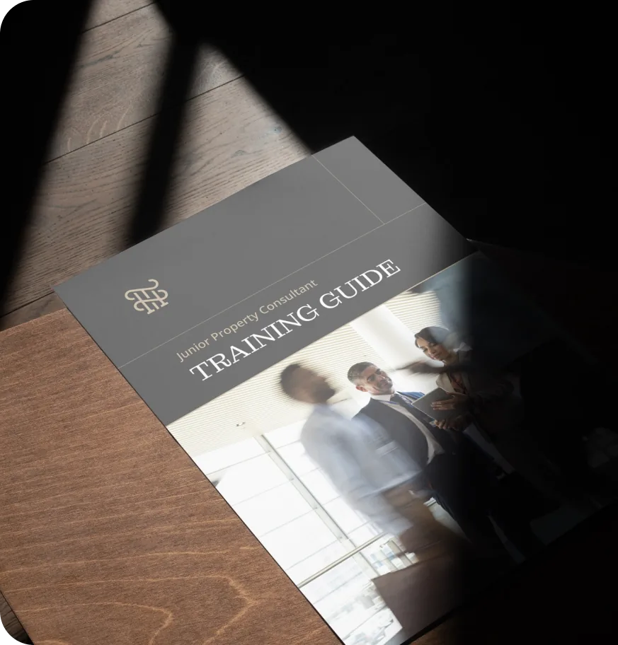 Thrive training guide for junior property consultants on a wooden table