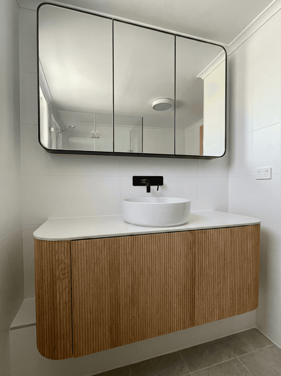 No Spots staff cleaning a mirror