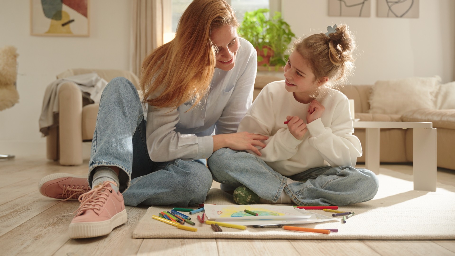 White branded cap with turquoise logo placed on fresh lemons in a red bowl