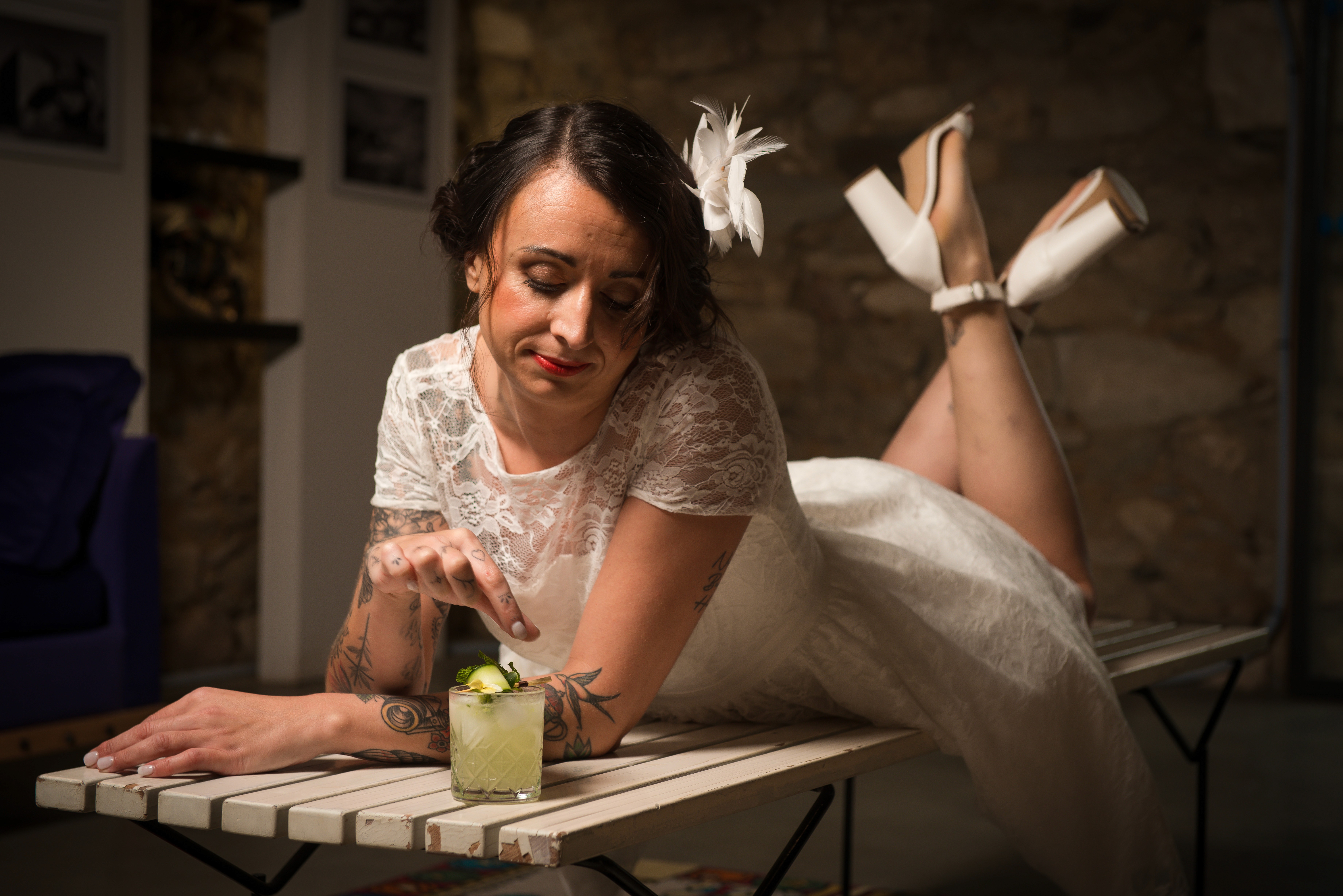 Bartenders working behind a bar with bottles