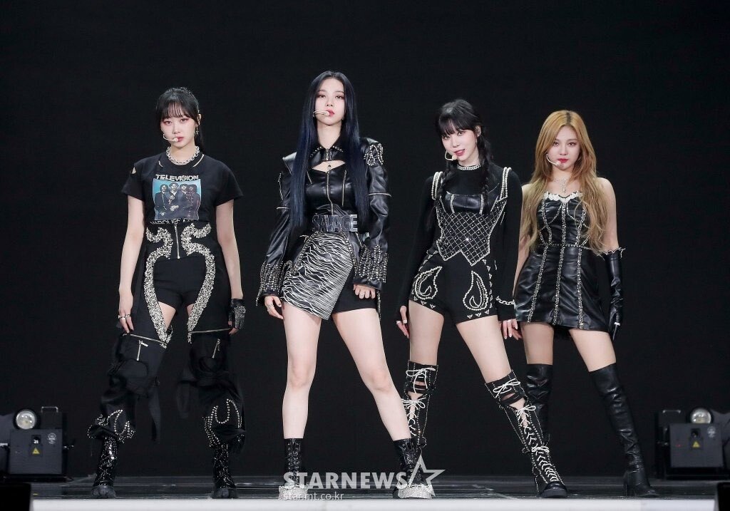 Streetside billboard with flyposters of the Batch.Works brand and illustrations