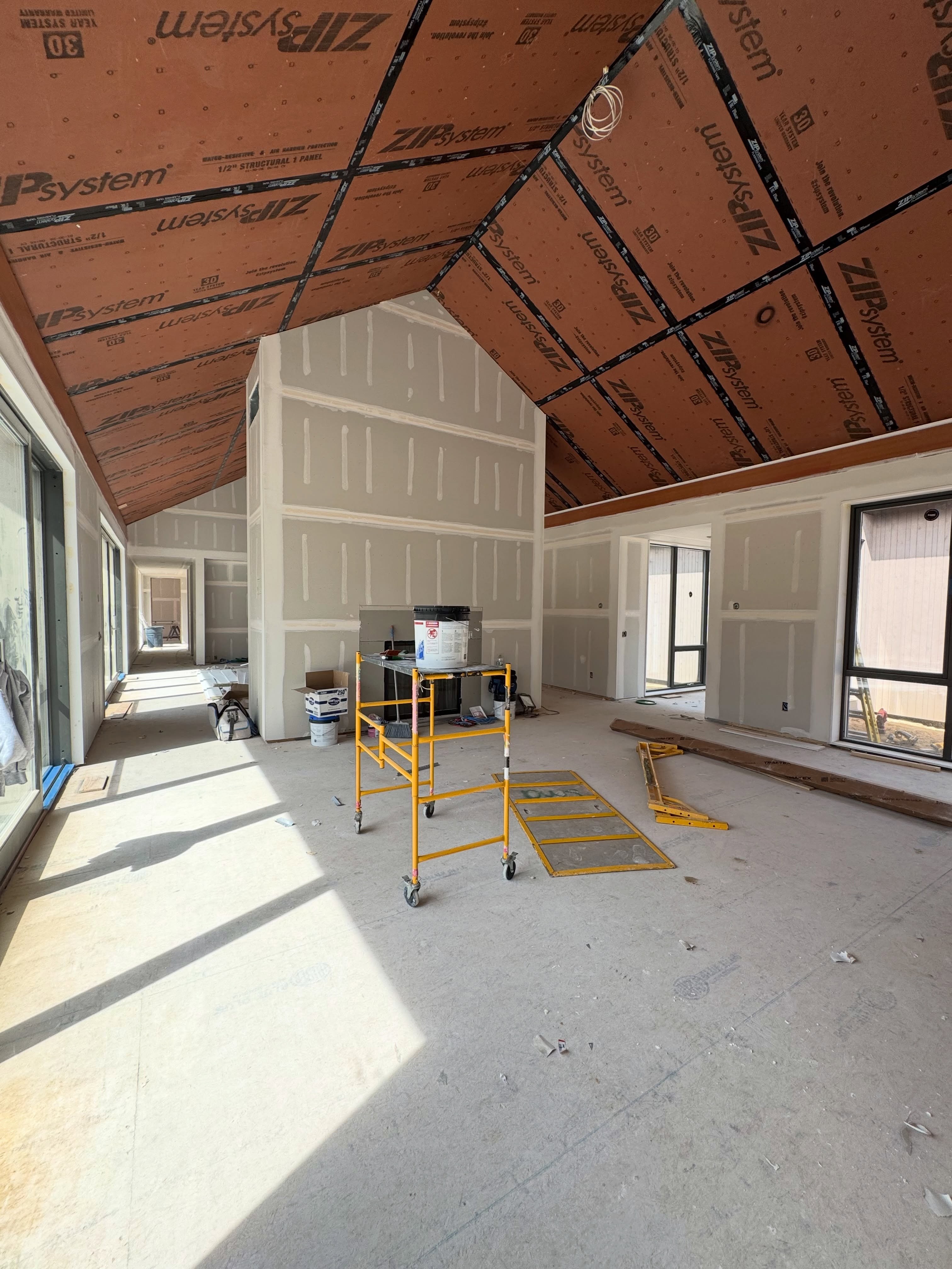 The same attic with the roof deck exposed before drywall