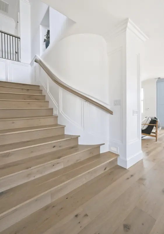 Portrait view of the stairway captured from the left, highlighting the structural details in the Dana Point Remodel. Photo by Todd Huge.