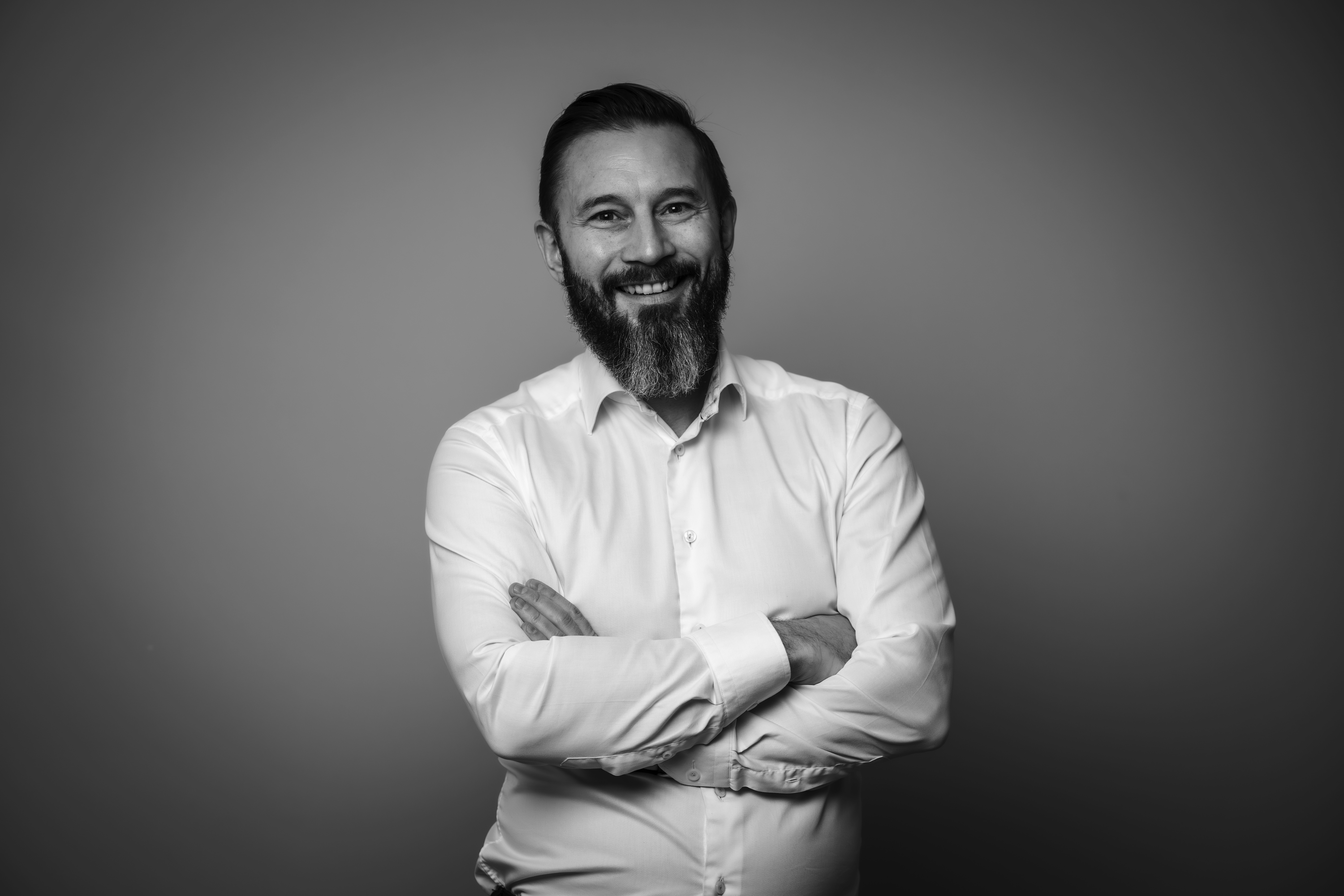 a man in a yellow shirt is on a red track