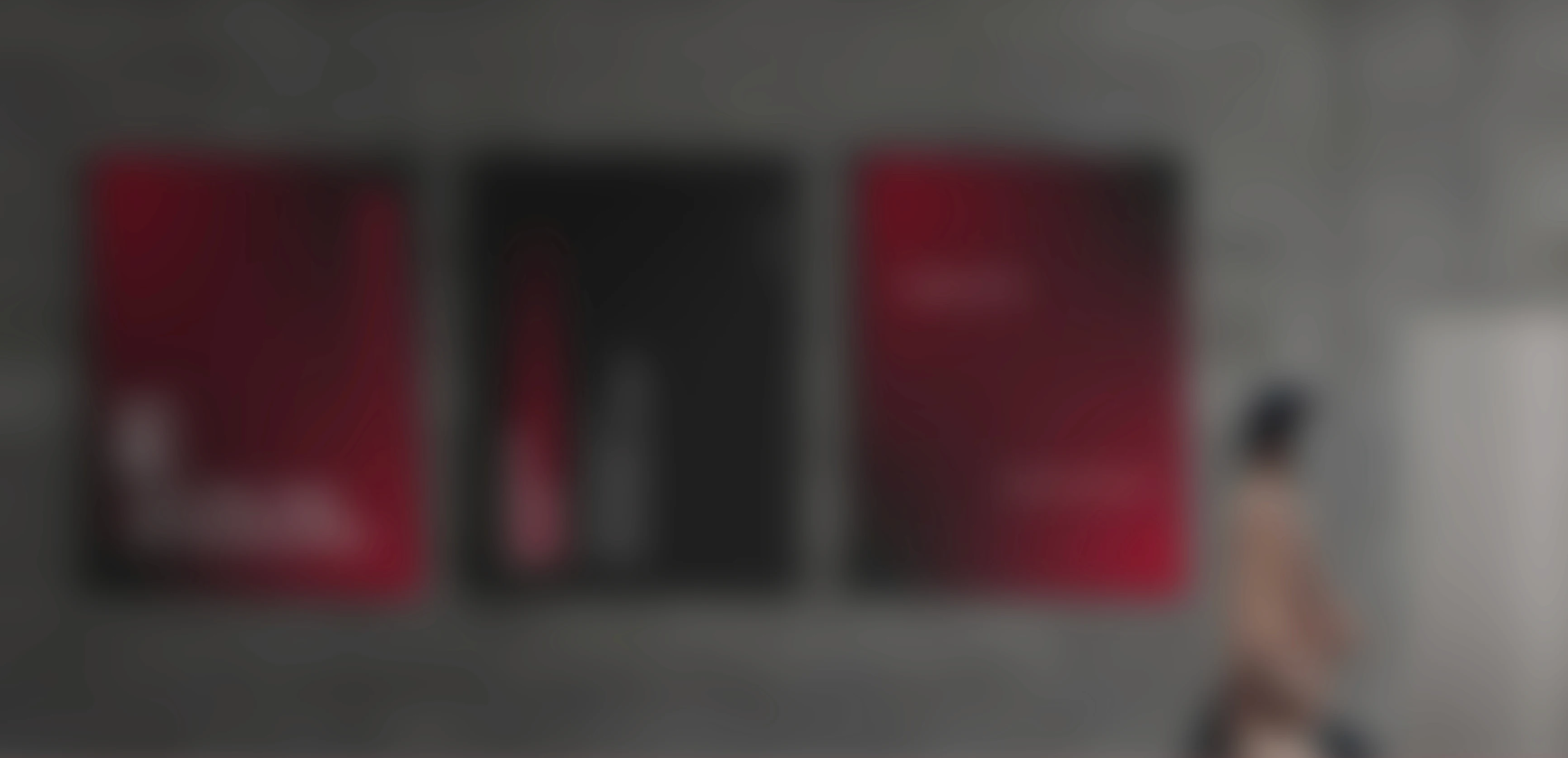 Slightly blurred futuristic bed with orange lighting, set against a city skyline.