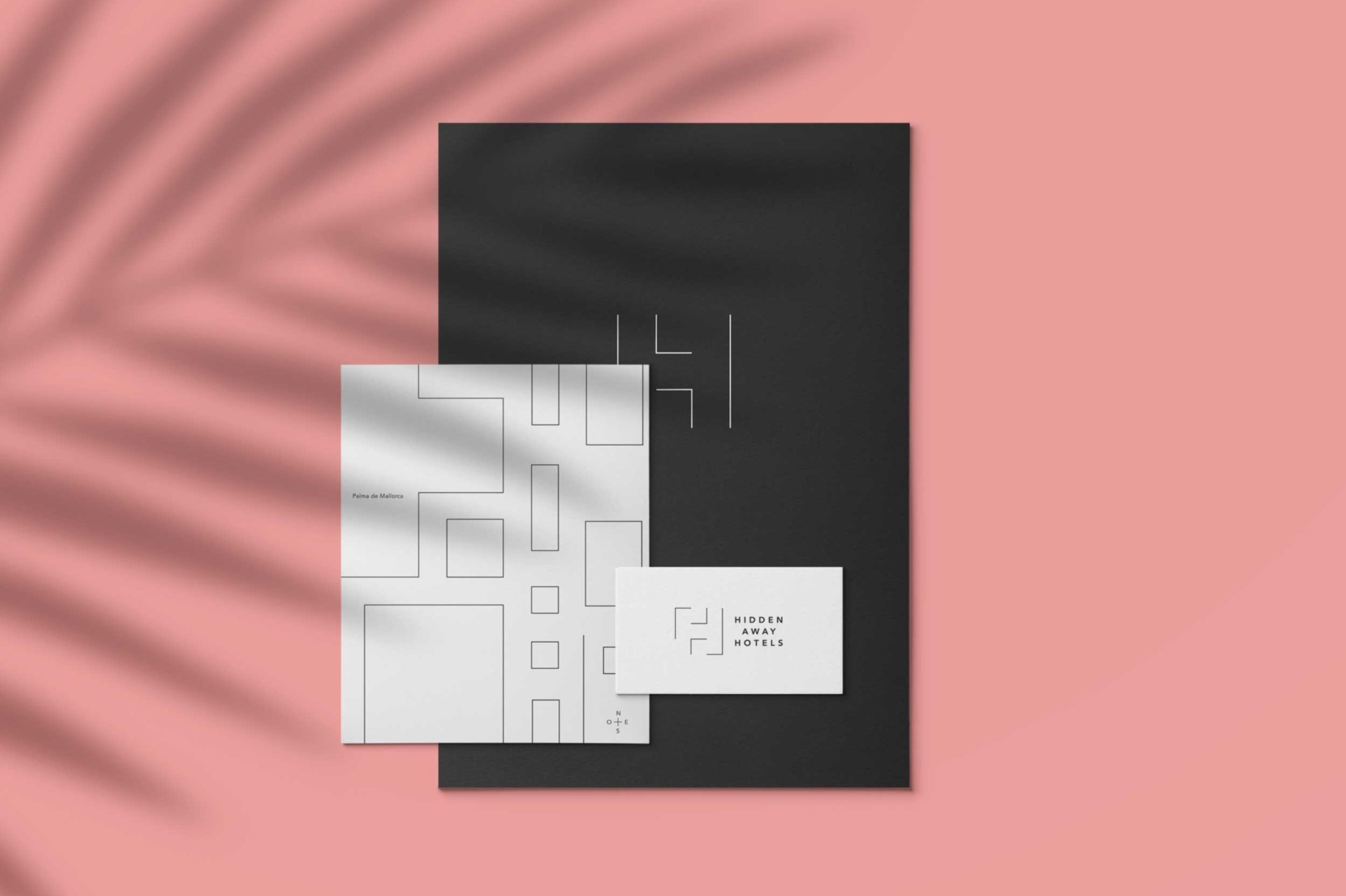 Papelería elegante sobre fondo rosa moderno, con diseño minimalista y tarjeta de presentación.
