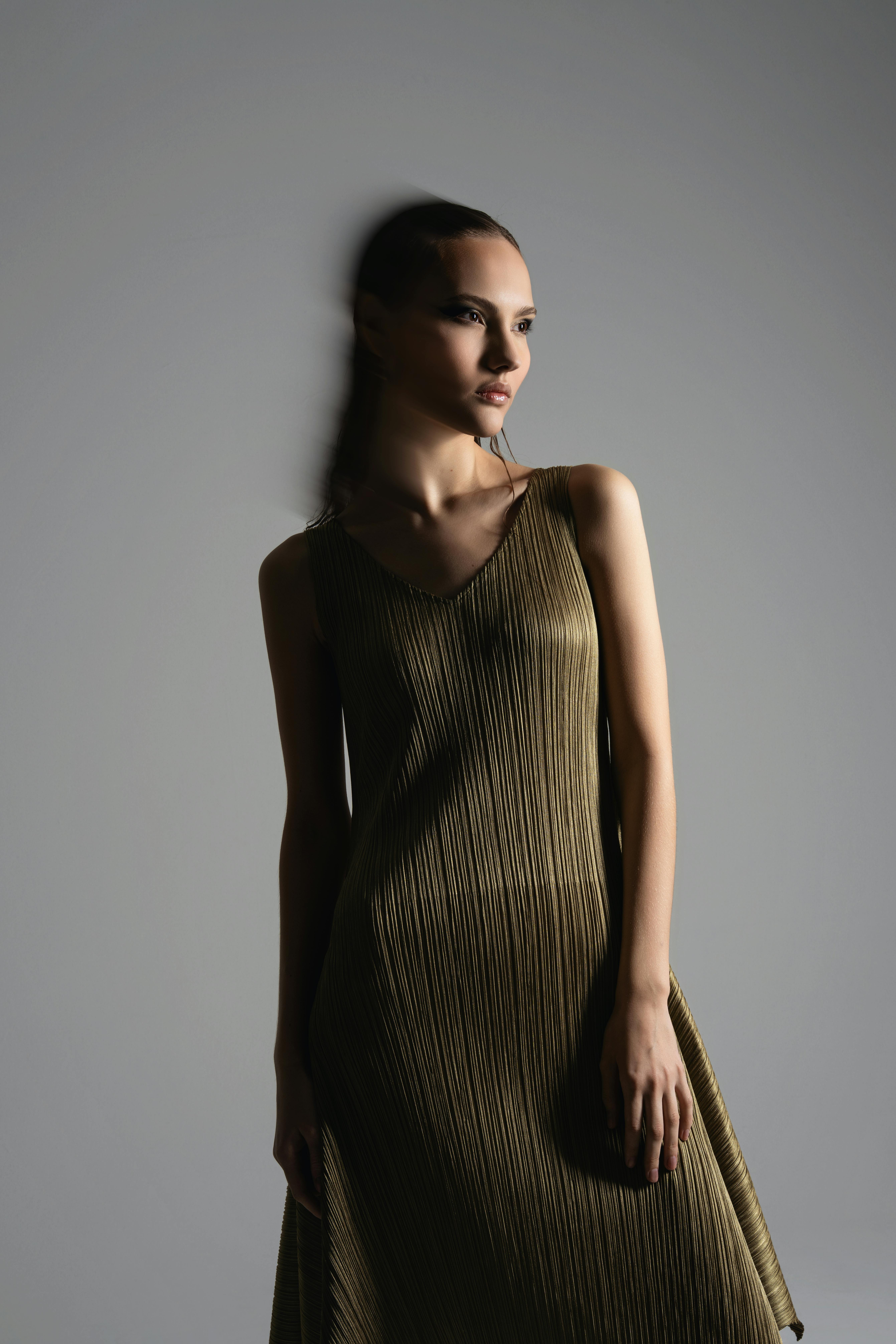 Woman in olive color dress