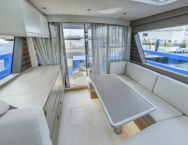 the elevated sleeping area with warm bedding, soft lighting, minimalist stairs, and smooth wood finishes.