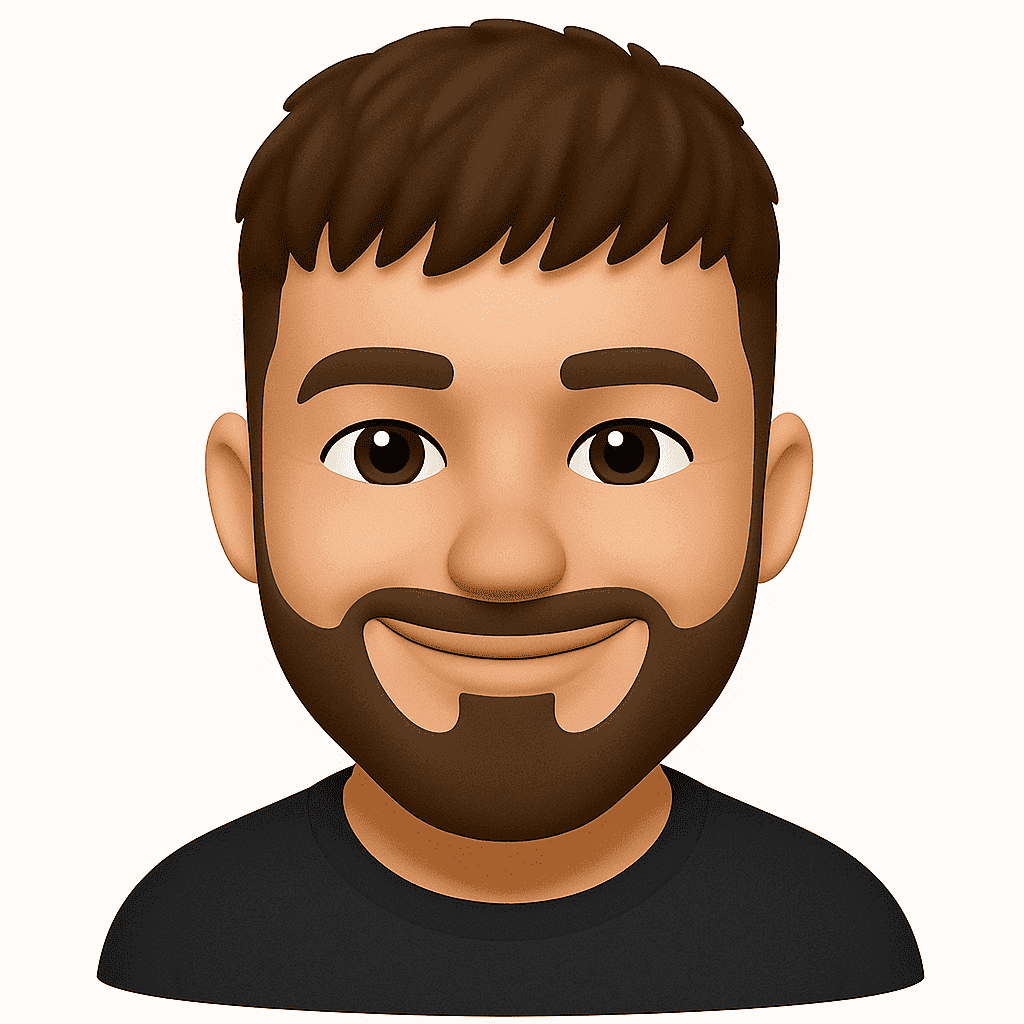 Person wearing a blue puffer jacket and red backpack standing in front of a light blue building on a city street.