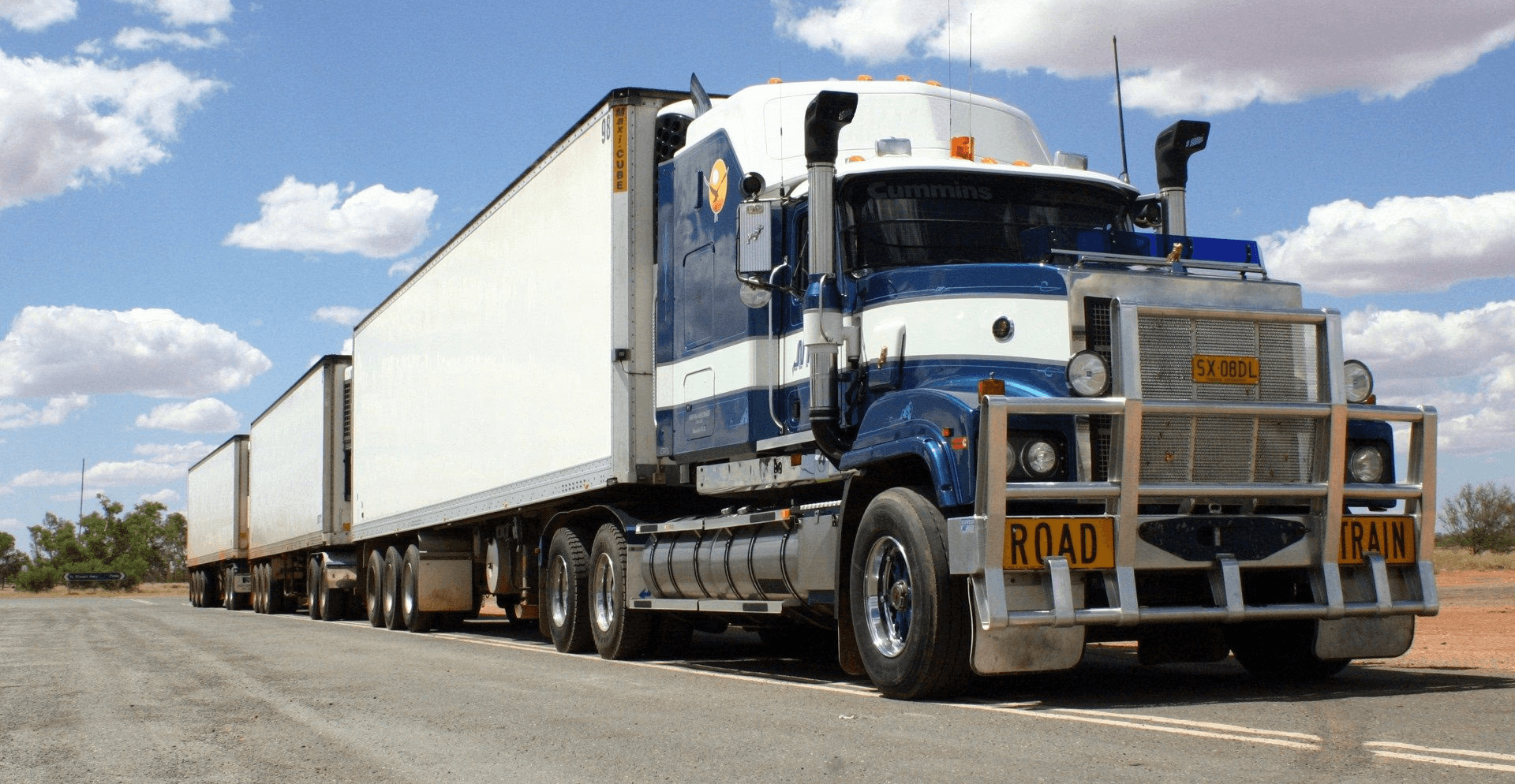 View of containers in motion at a large logistics hub located in a port.