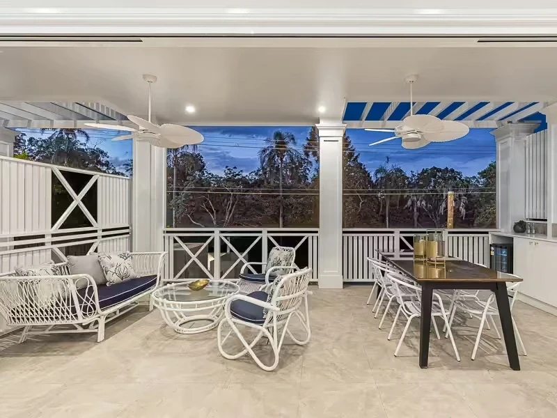 Front balcony for outdoor living with integrated ceiling fans