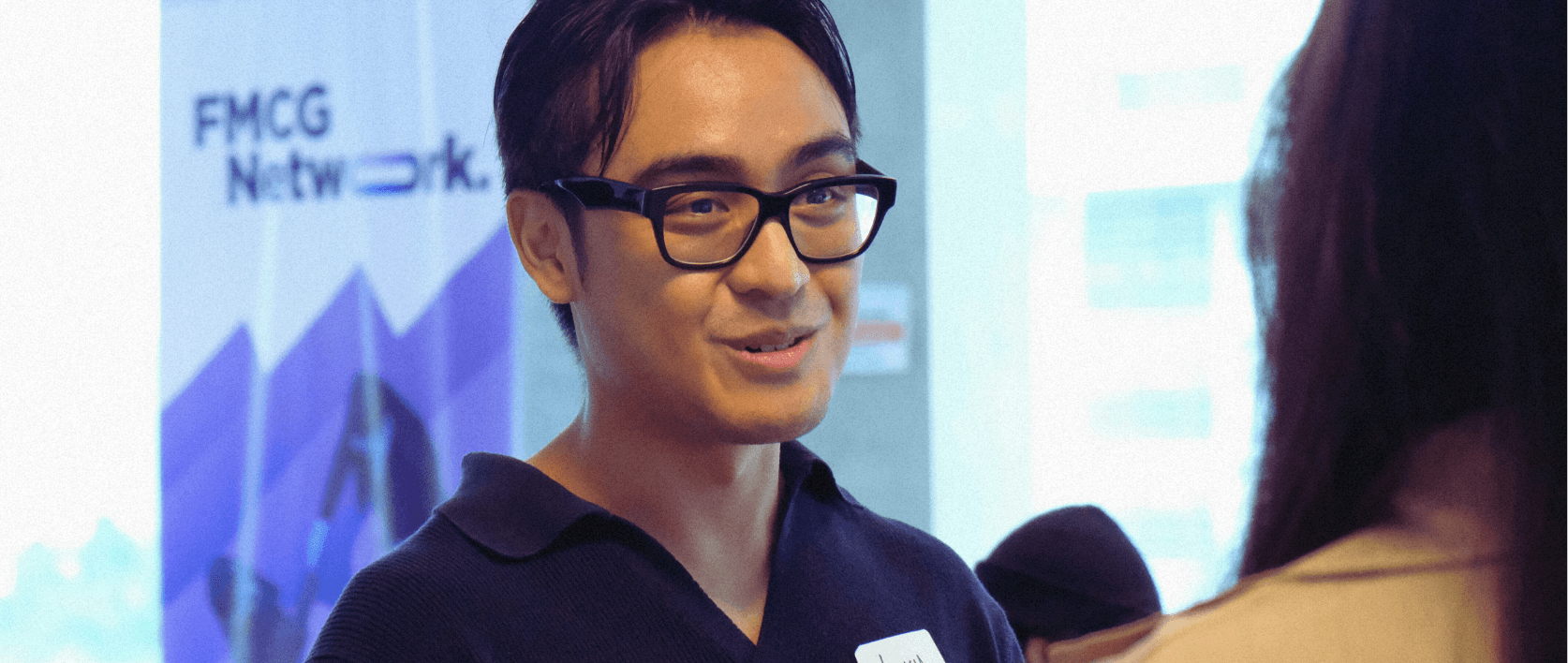 a woman sitting on a roof talking on a cell phone