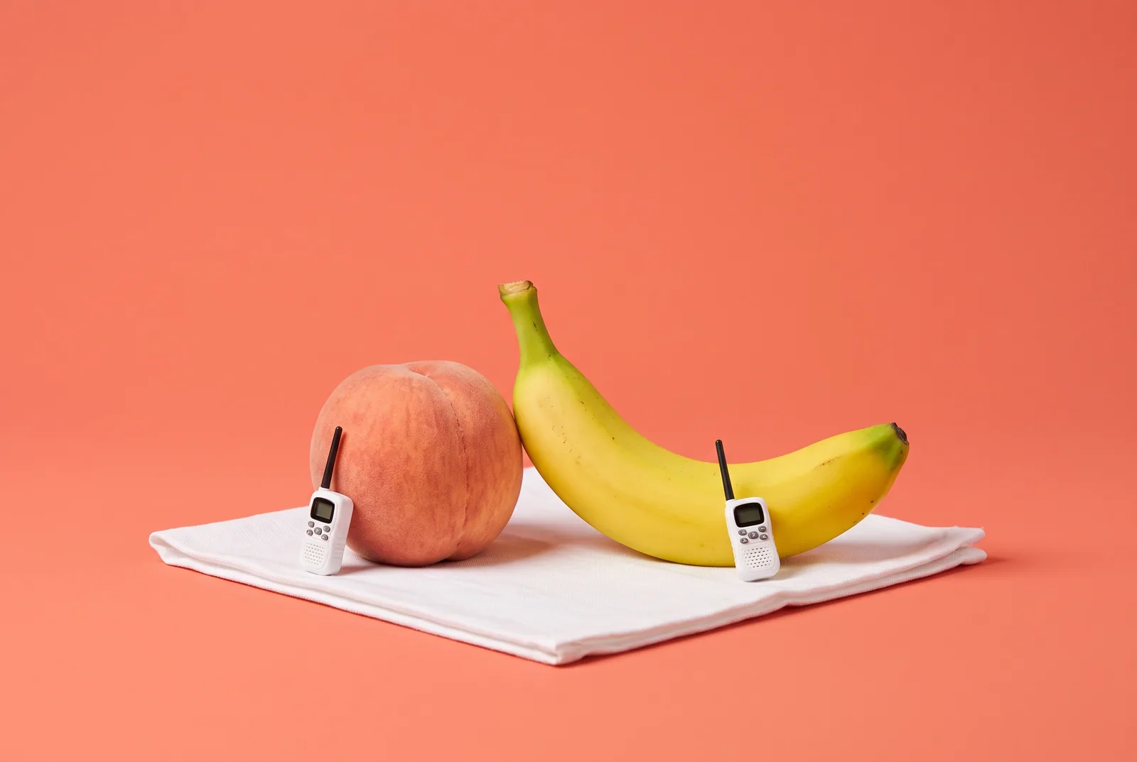 A peach and a banana on a blanket with tiny walkie-talkies, how to talk when your boyfriend watches porn