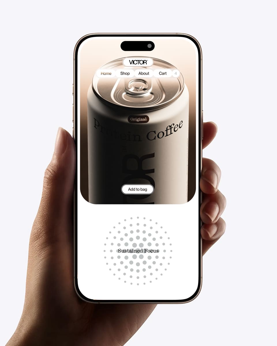 A hand holding a phone in which appears a can of coffe from VICTOR's project.