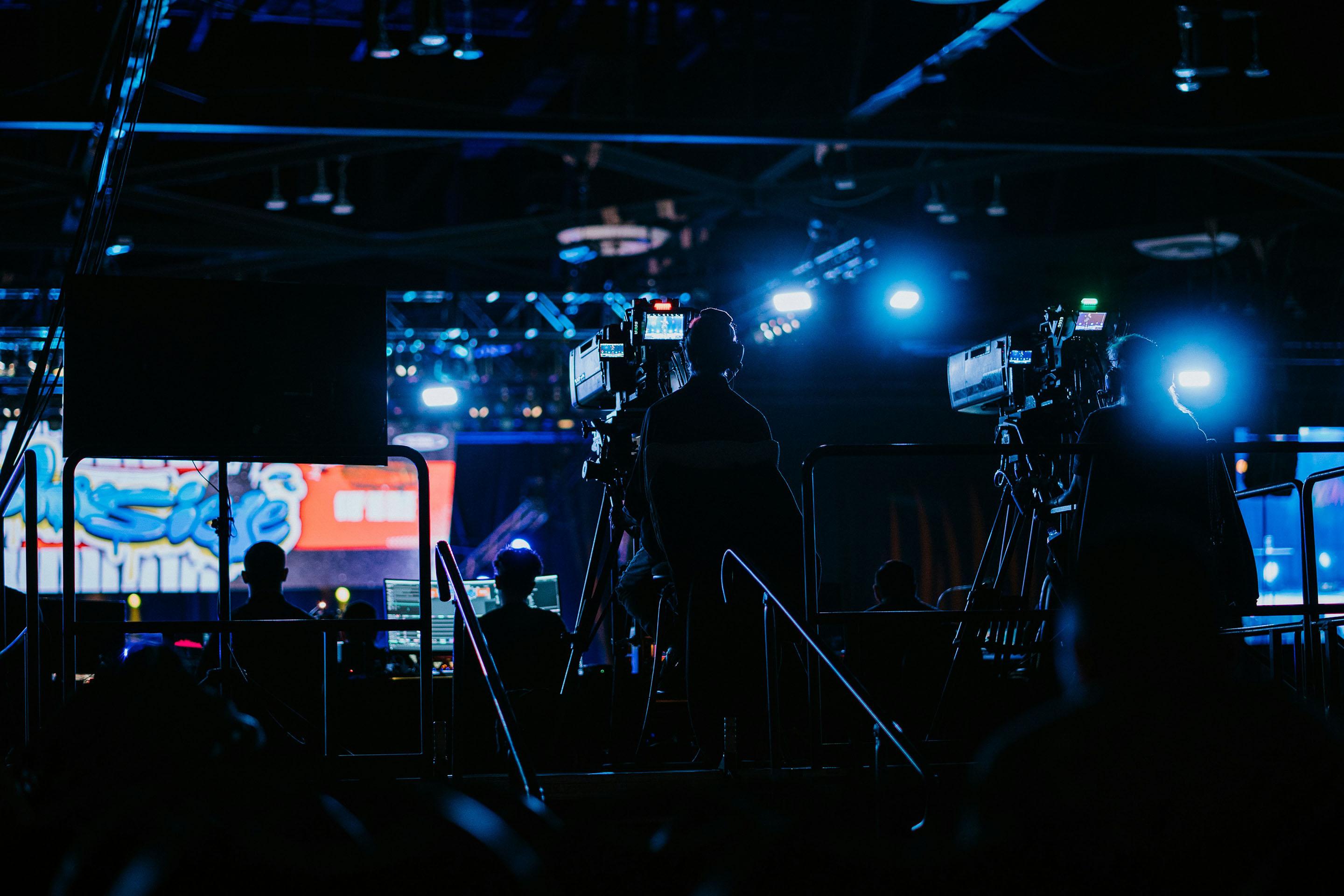 a group of people standing in front of a camera