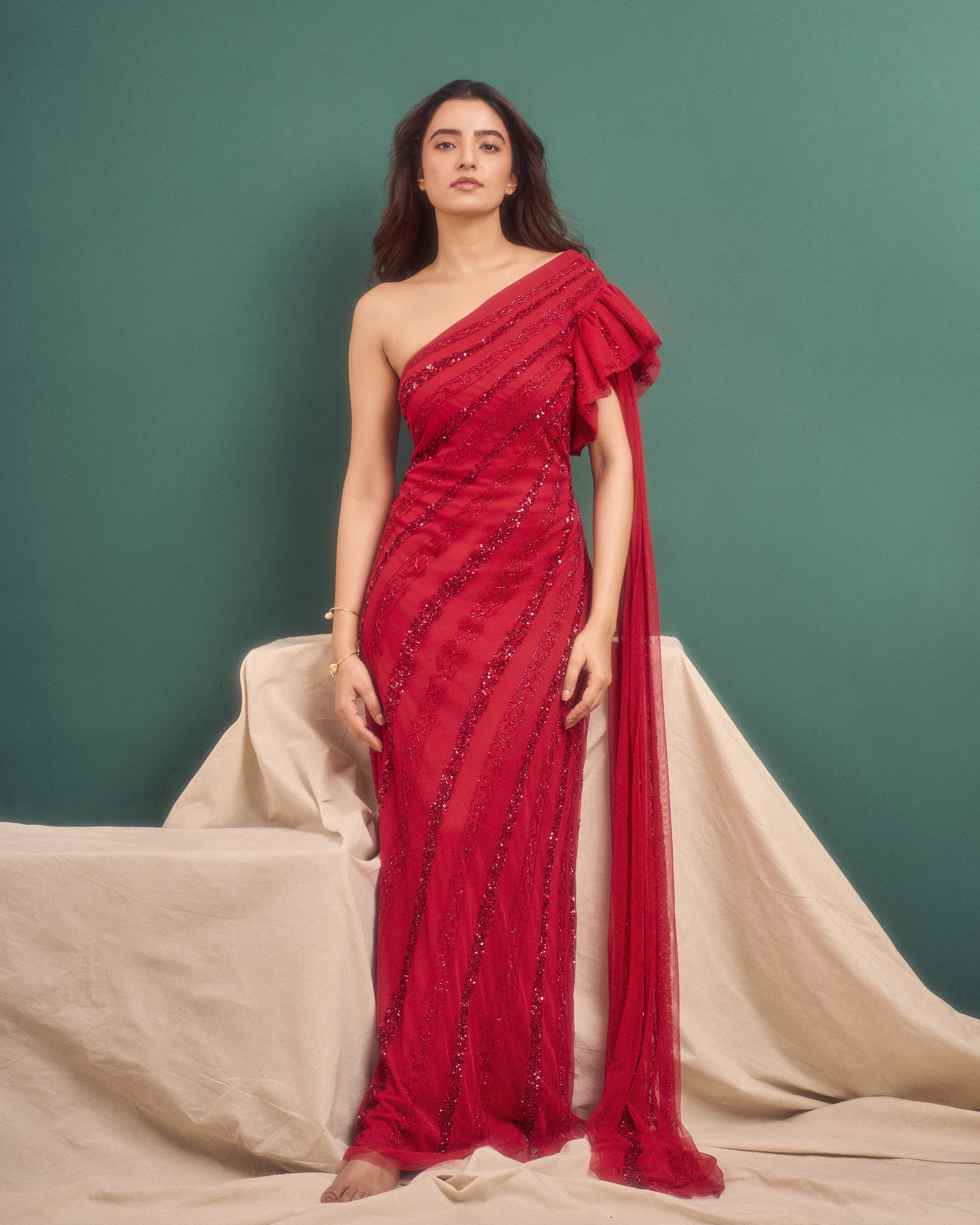 Group of friends smiling on a lively city street at night