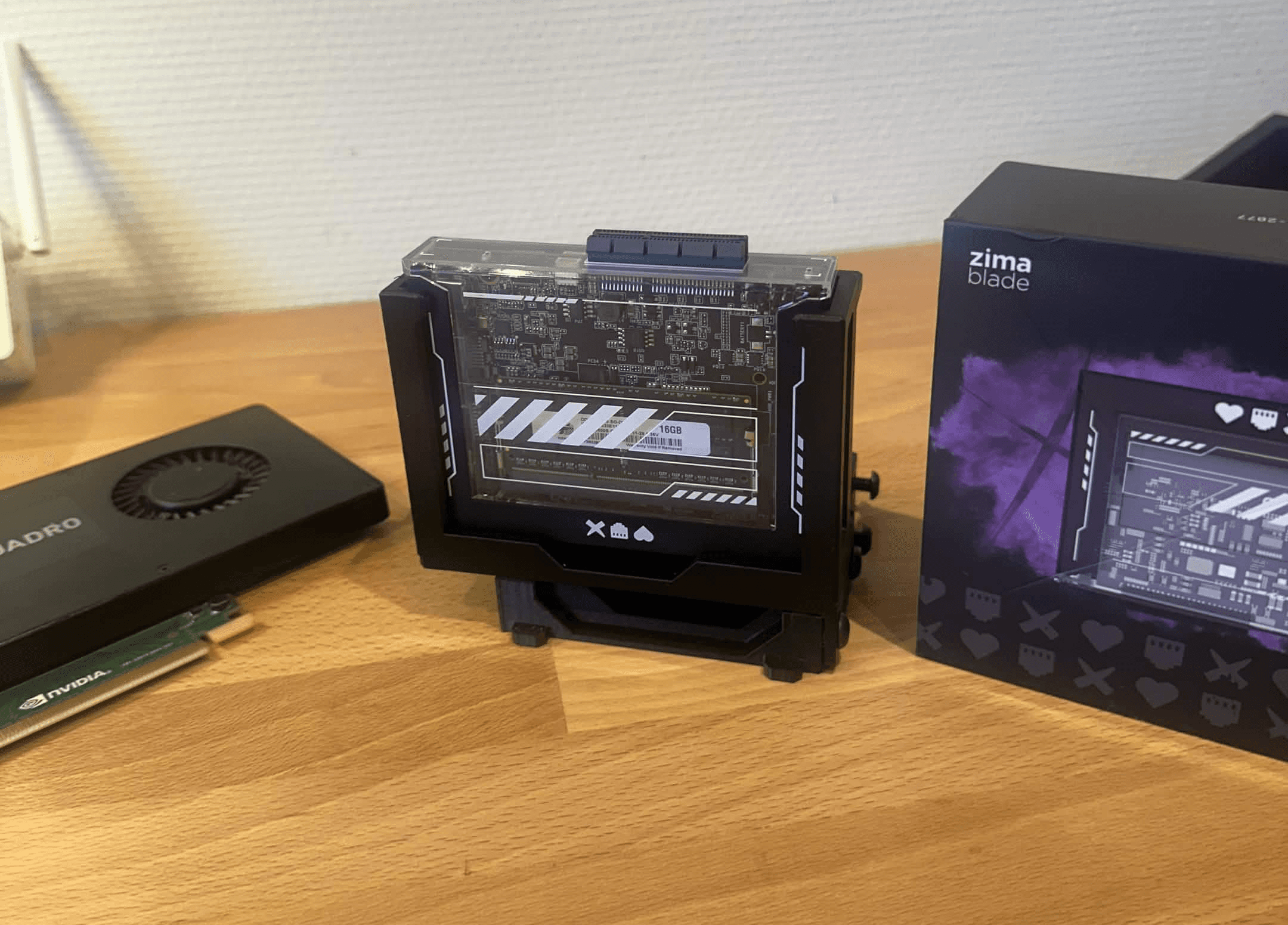 black 3D-printed microRACK with separate spaces for a ZimaBlade and a 2.5-inch storage drive.