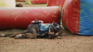 Paintball Player Crawling on Field