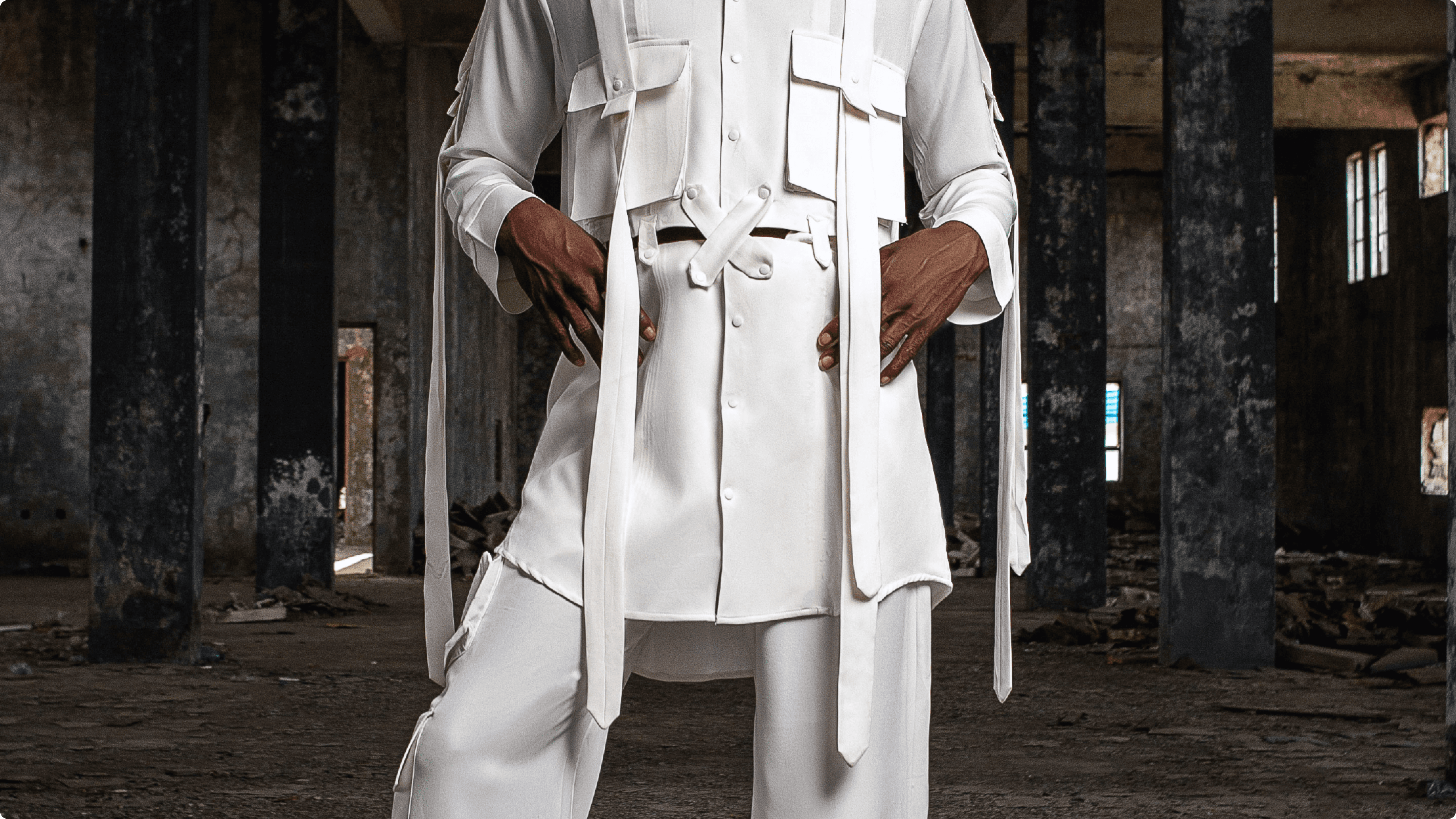 Black drawstring fabric bag set against pitch-black, printed centrally with the distressed white Deadpan smiley face logo (X eyes, tongue out).