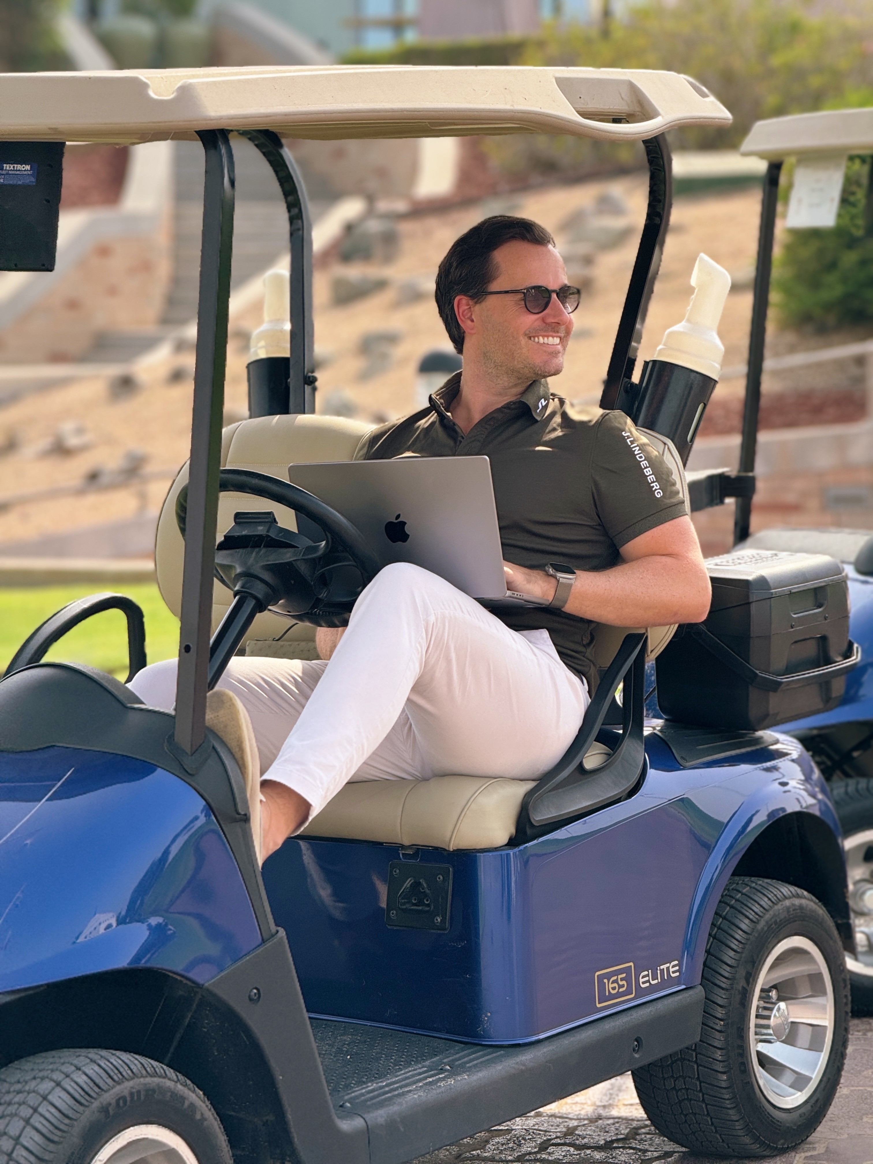 Timothy-Beumer-sitting-in-golf-cart