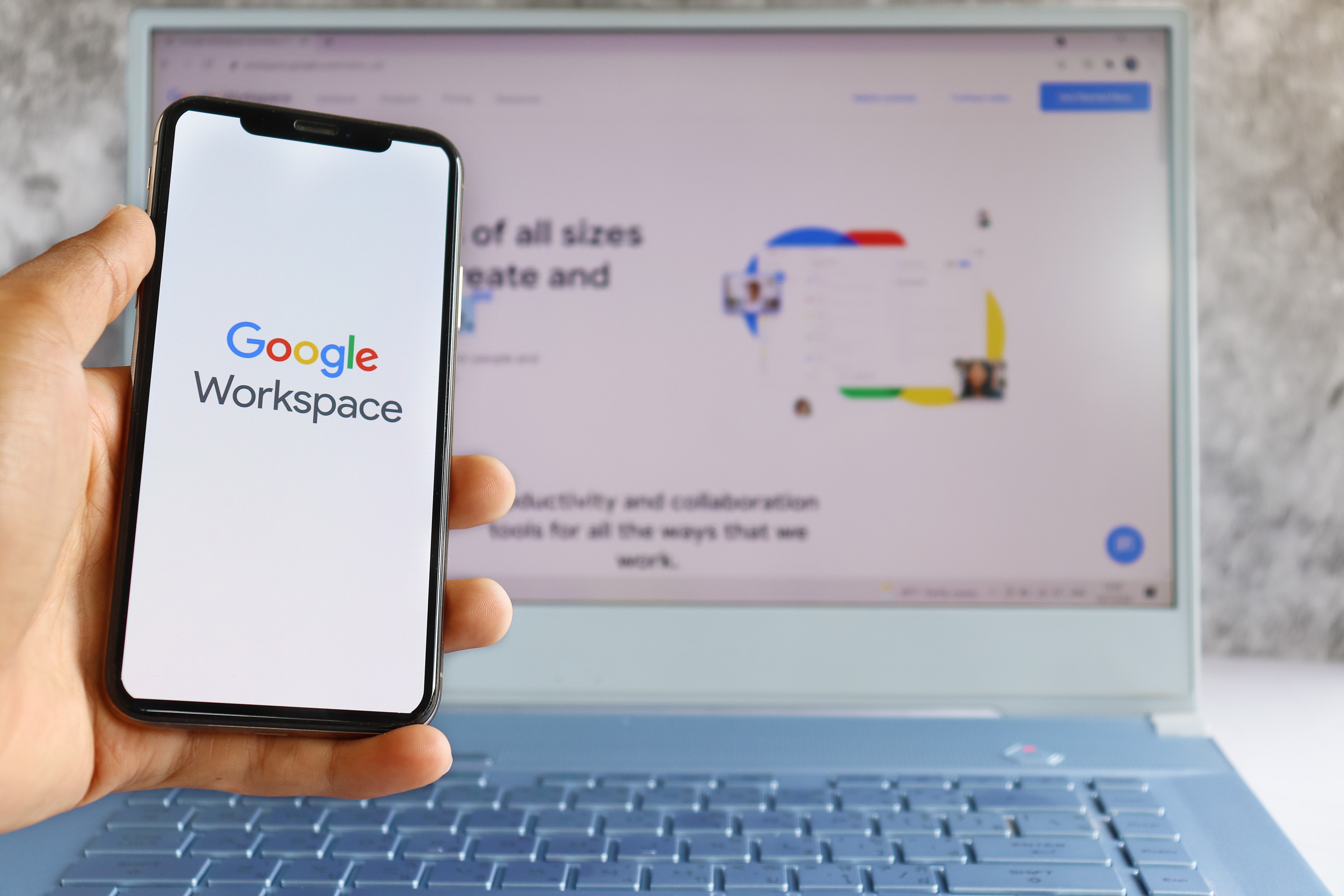 Google workspace logo on computer screen and Google workspace logo is seen on mobile phone screen.