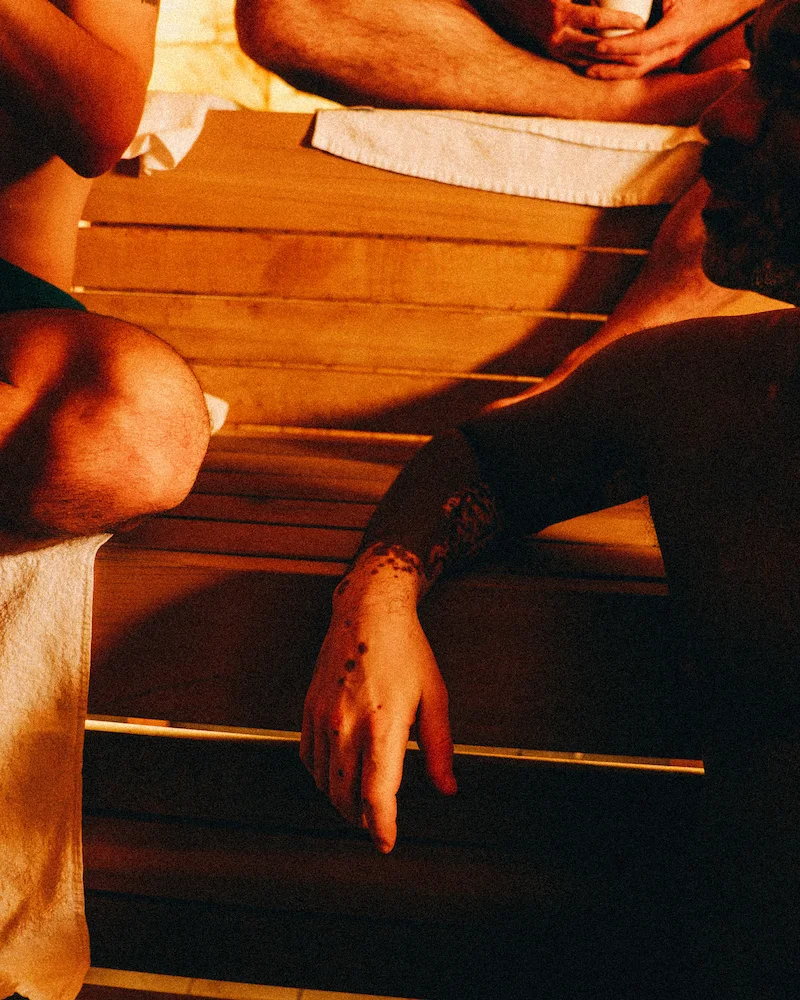 Sauna environment supporting the stress relief benefits of sauna and cold plunge routines.