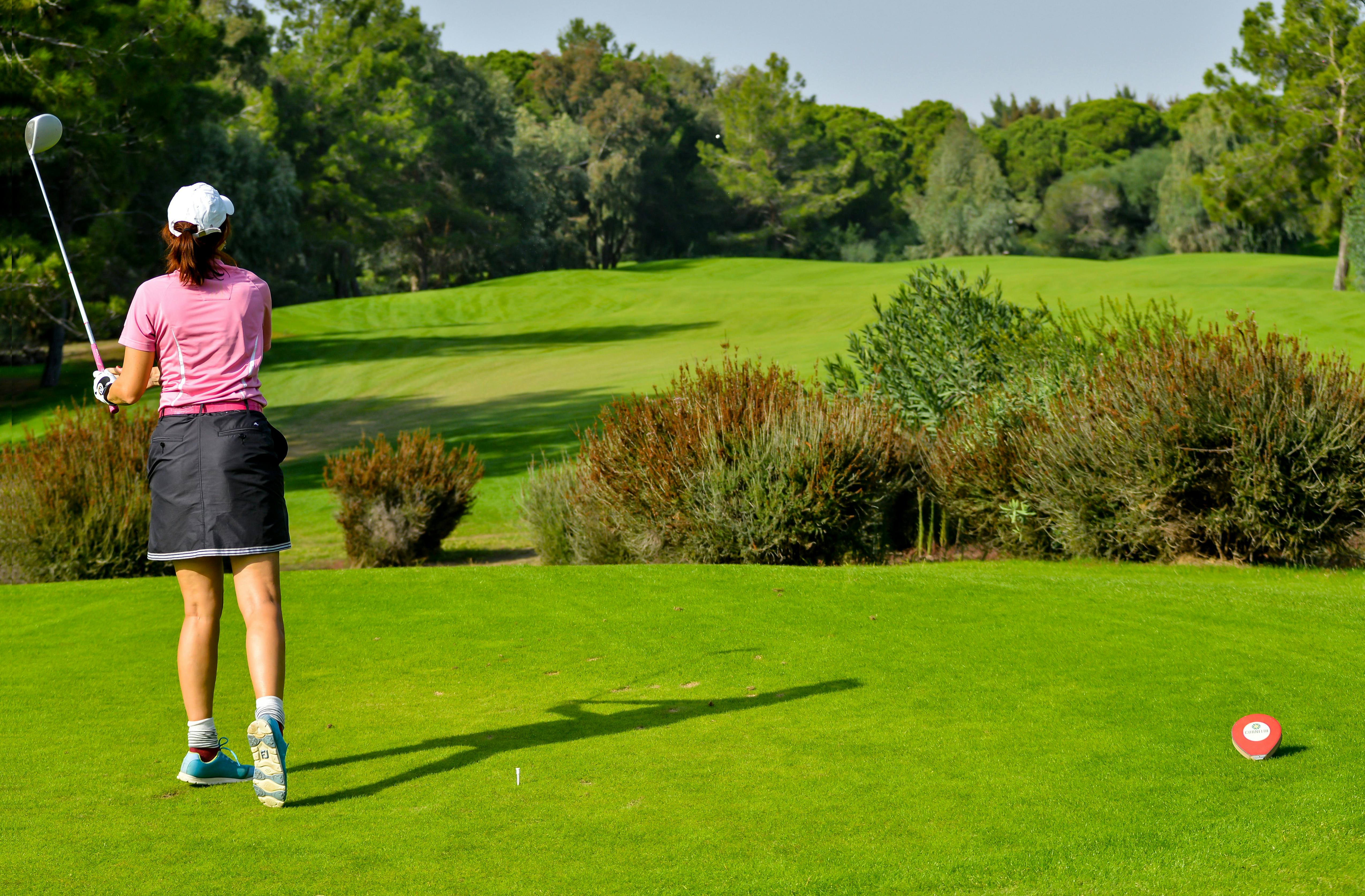 A woman playing golf