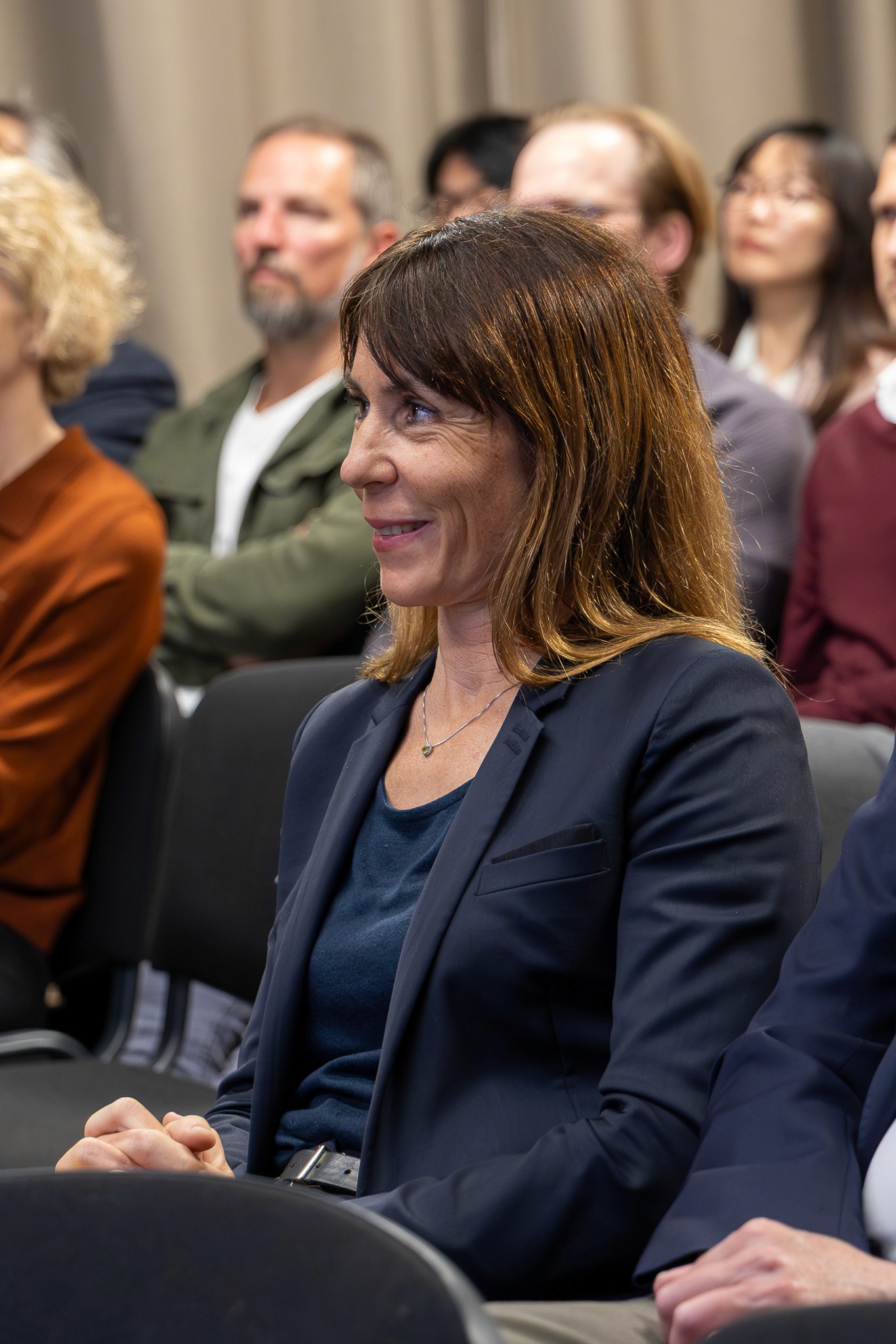 Conference guest following a live panel discussion.