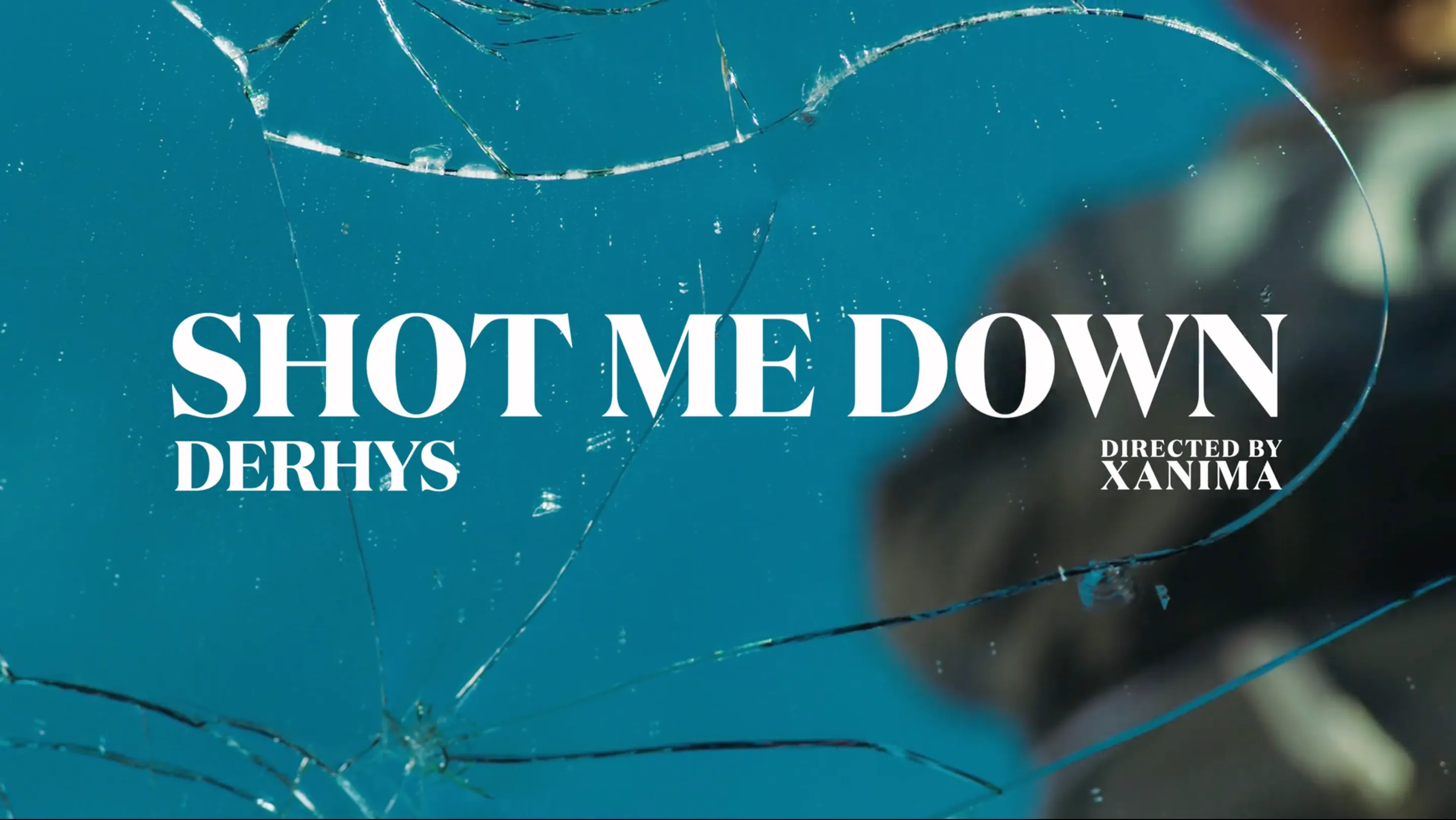 Cracked glass reading "Shot Me Down, Dehrys, directed by X ANIMA