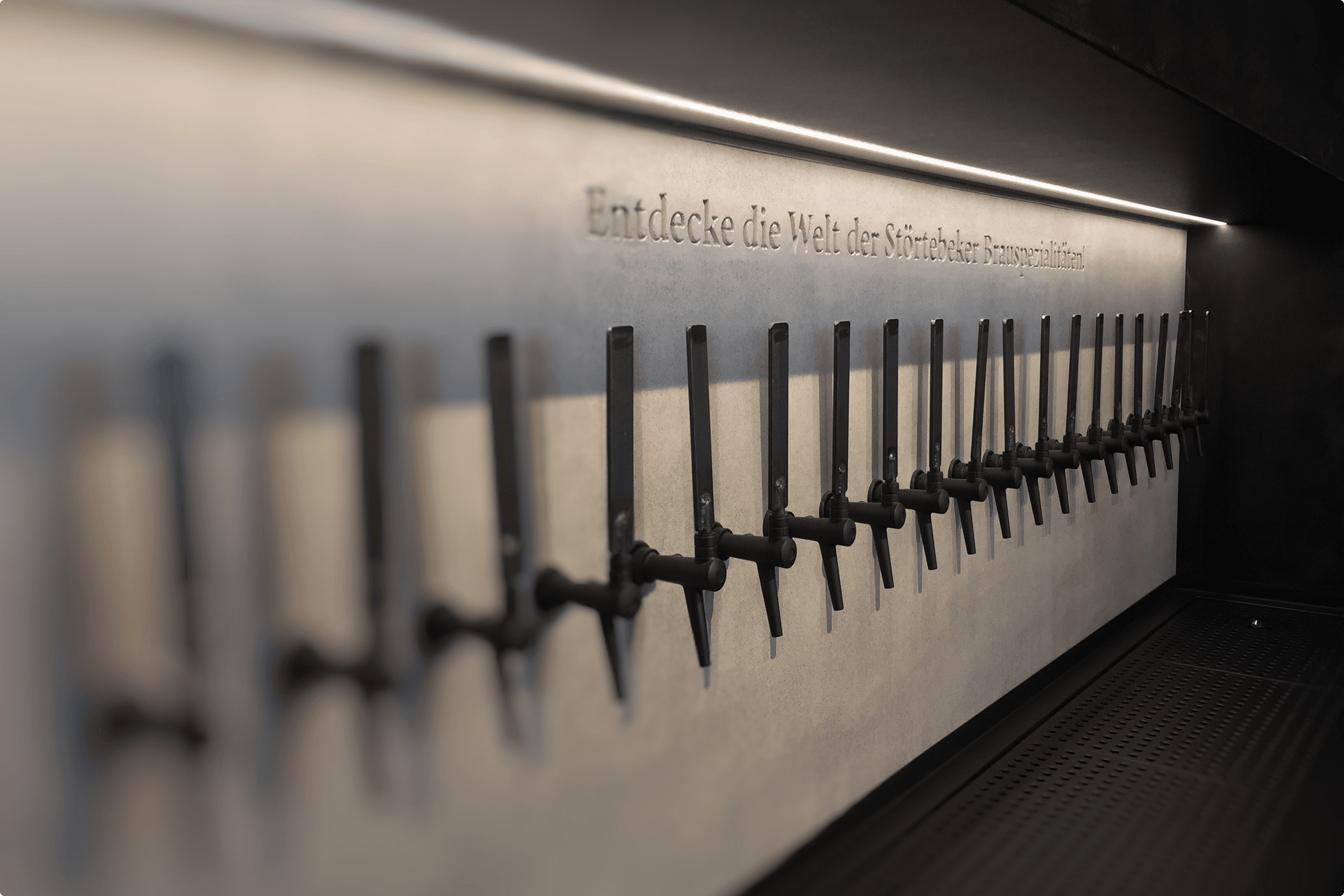 Rows of beer taps on a wall