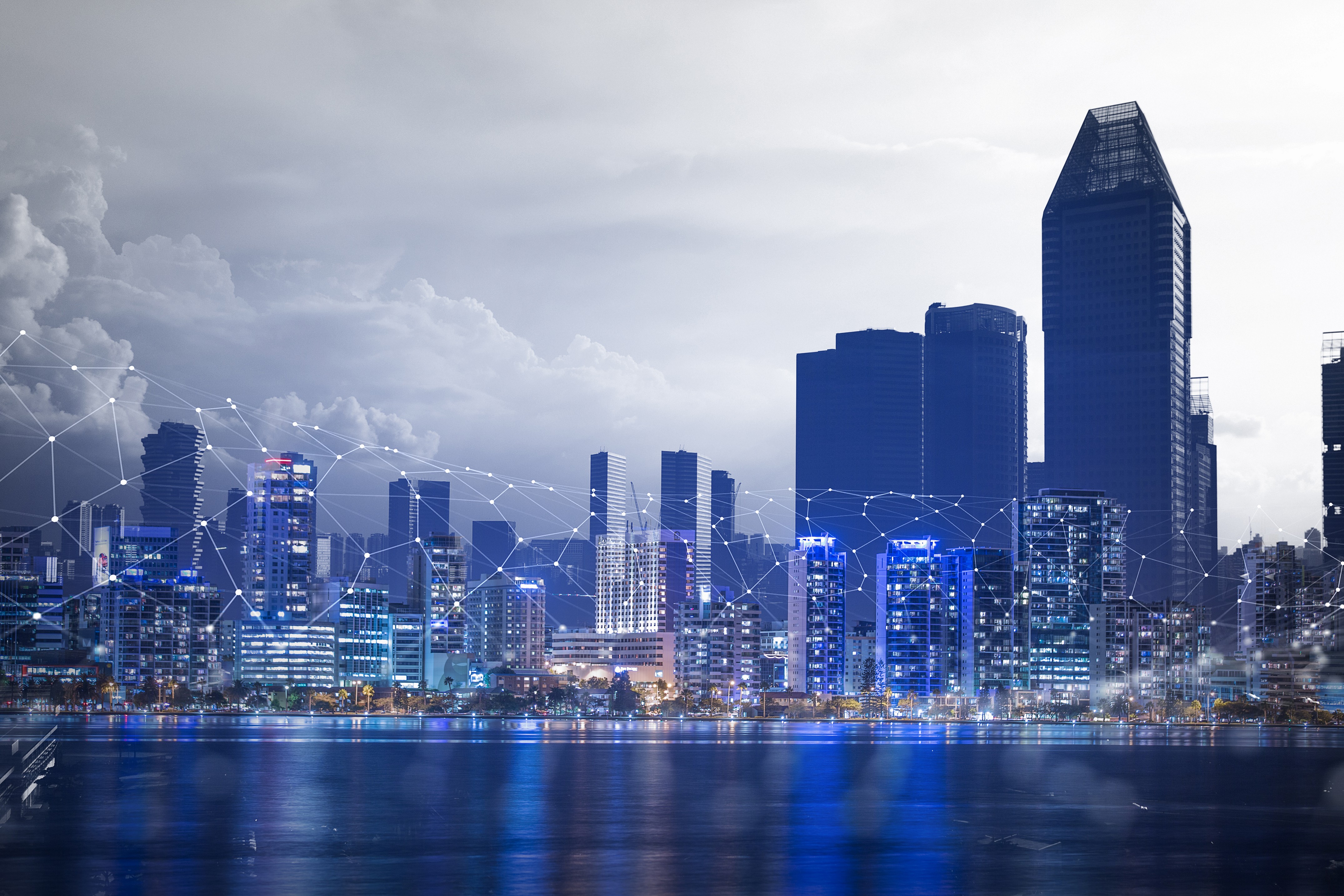 Image of a modern NYC skyline at dusk with glowing office lights symbolizing the city’s 247 digital activity.