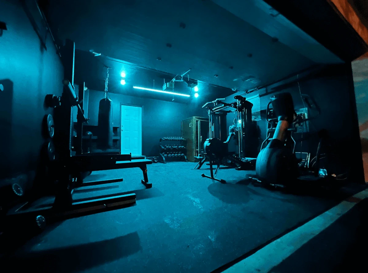 Custom home gym build with cardio machines and strength training equipment designed for a private fitness space in Canada.