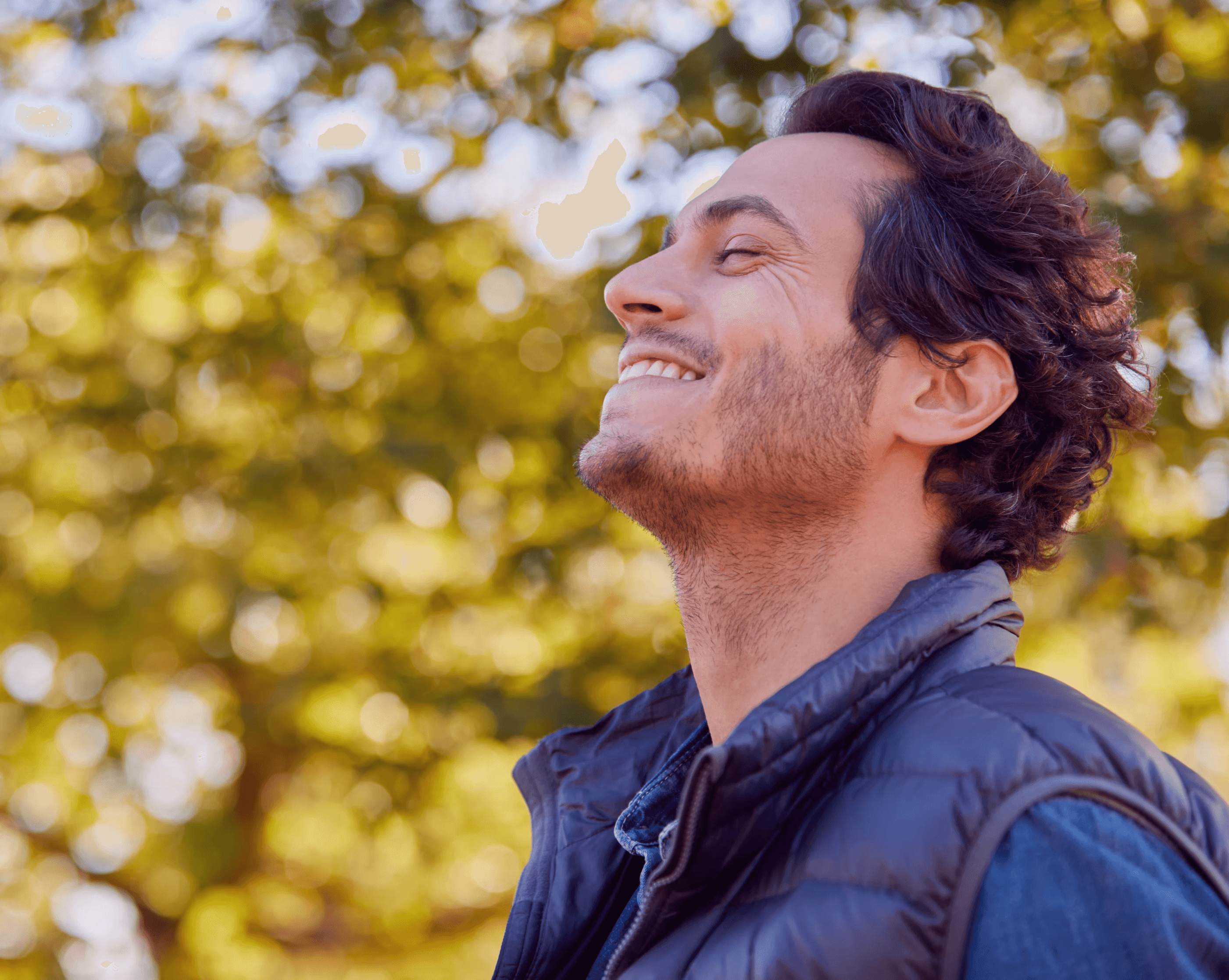 Man happily breathing outside